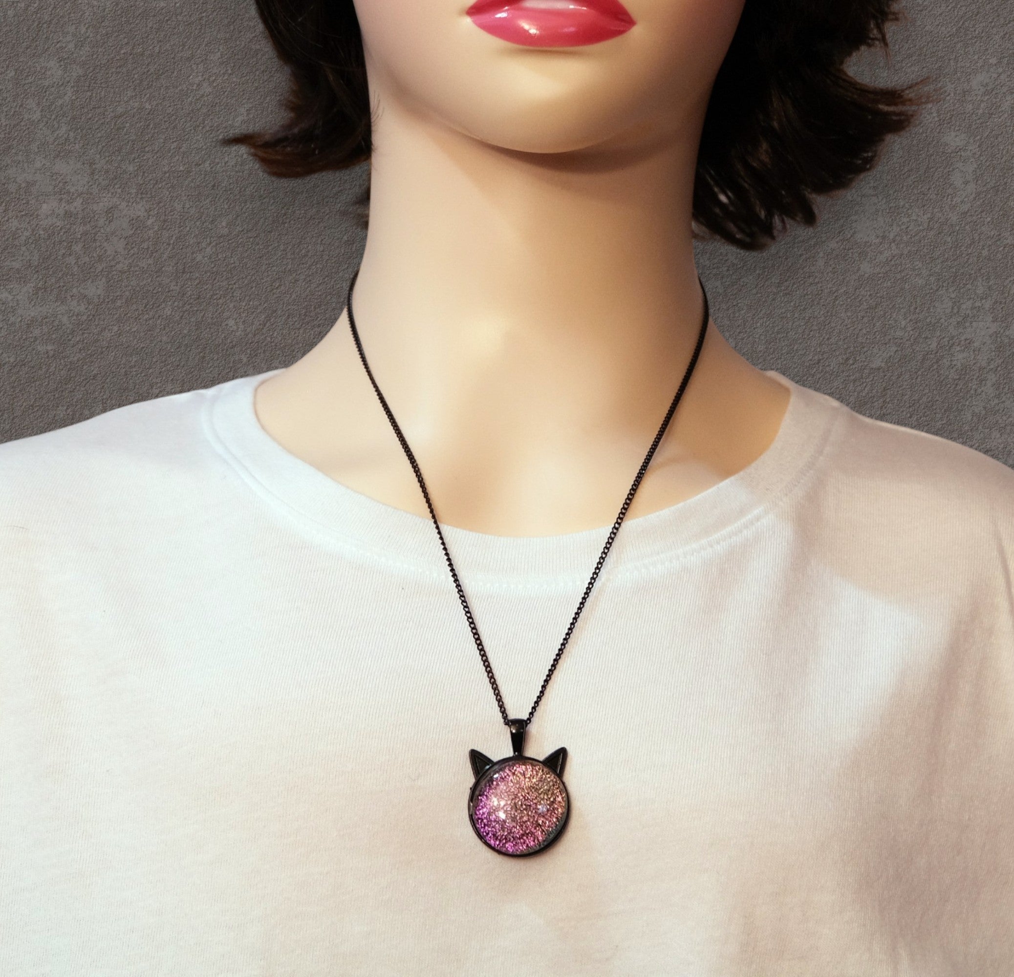 Mannequin wearing a necklace with a decorative pendant