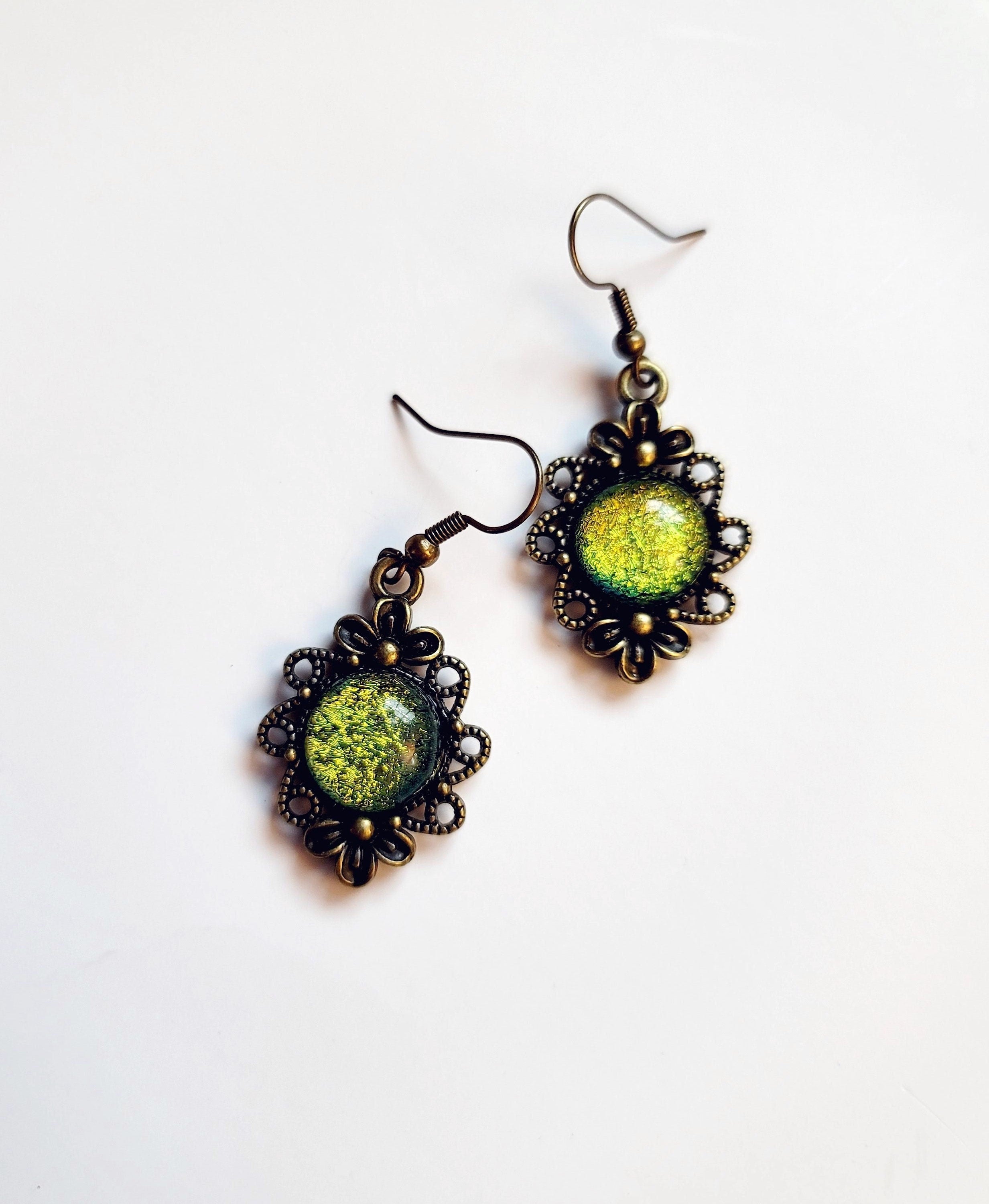 Brass flower earrings with color shifting green/yellow dichroic fused glass cabo pierced earrings seeds glassworks seedsglassworks