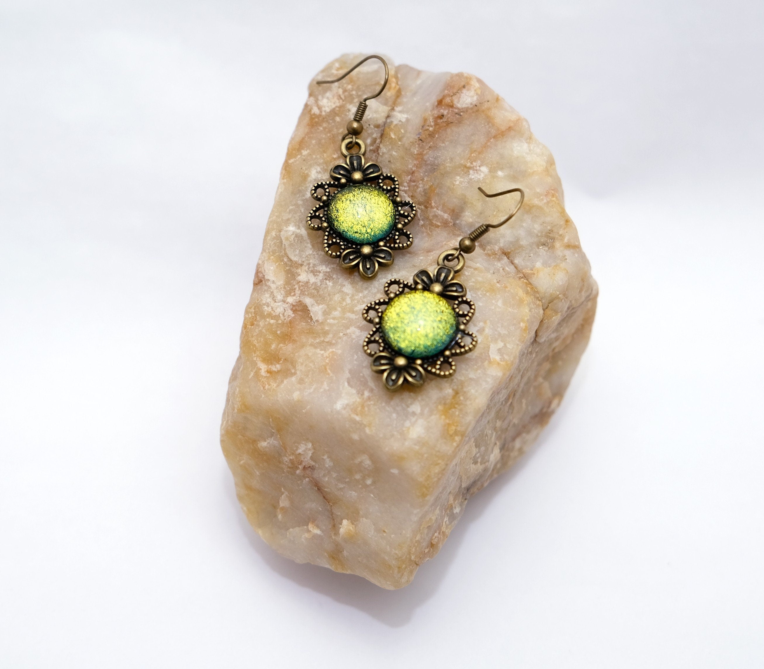 Brass flower earrings with color shifting green/yellow dichroic fused glass cabo pierced earrings seeds glassworks seedsglassworks