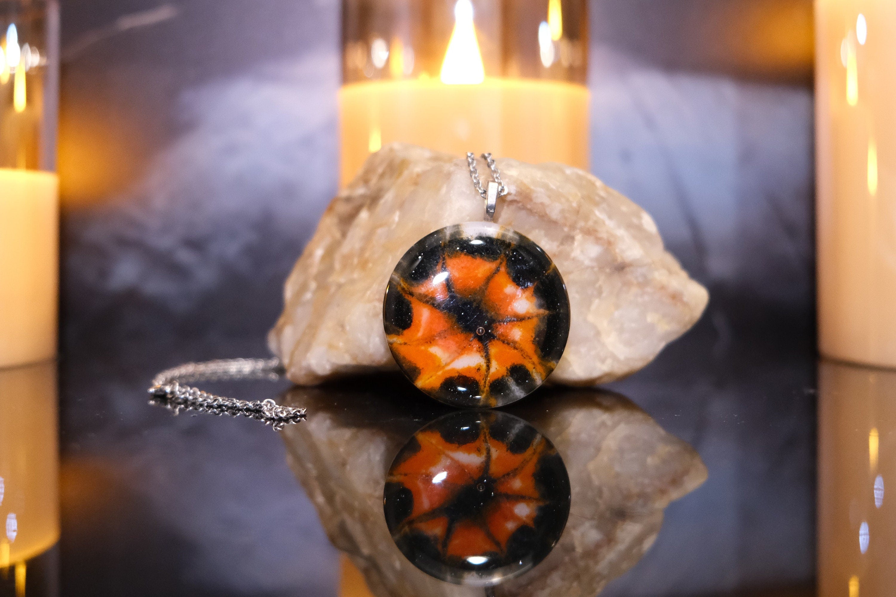 Tie Dye look Halloween fused glass pendant necklace jewelry in black, white and orange on 20 inch steel chain seeds glassworks seedsglassworks