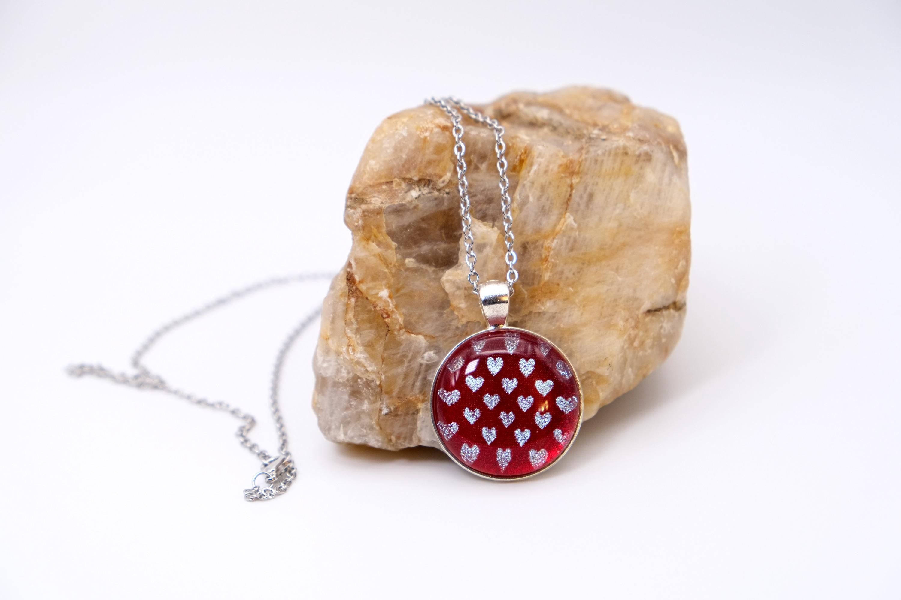 Silver tone pendant necklace with Fused Glass Red with dichroic hearts pattern cabochon on 24 inch steel chain jewelry seeds glassworks seedsglassworks