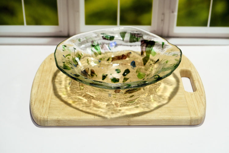 Unique 8.5 Inch one of a kind fused glass bowl with dichroic, green and purple accents on a clear base. organic shape. home decor gift
