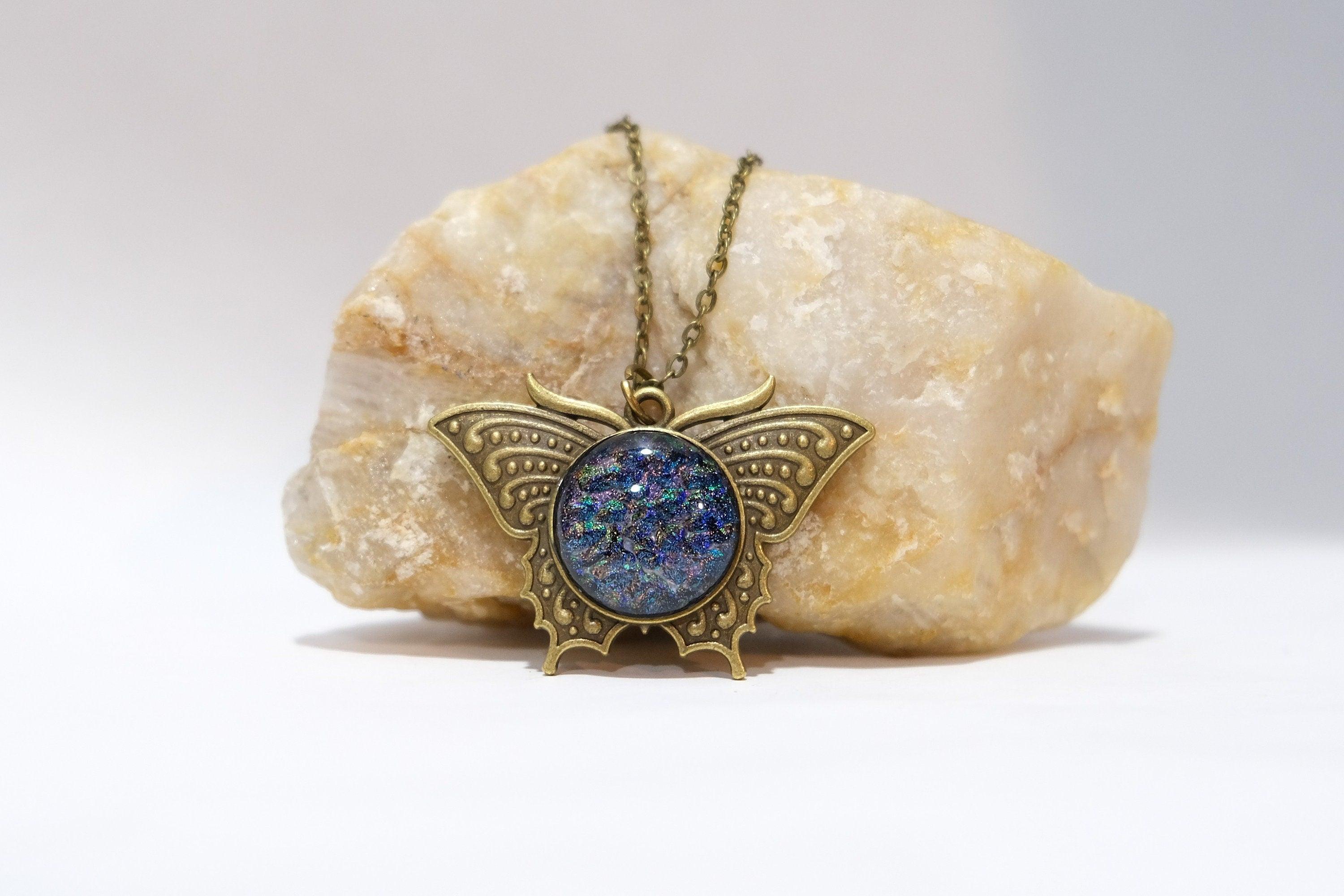 Butterfly pendant necklace, brass tone with blue/multicolor dichroic fused glass center stone on a 20 inch brass toned chain seeds glassworks seedsglassworks