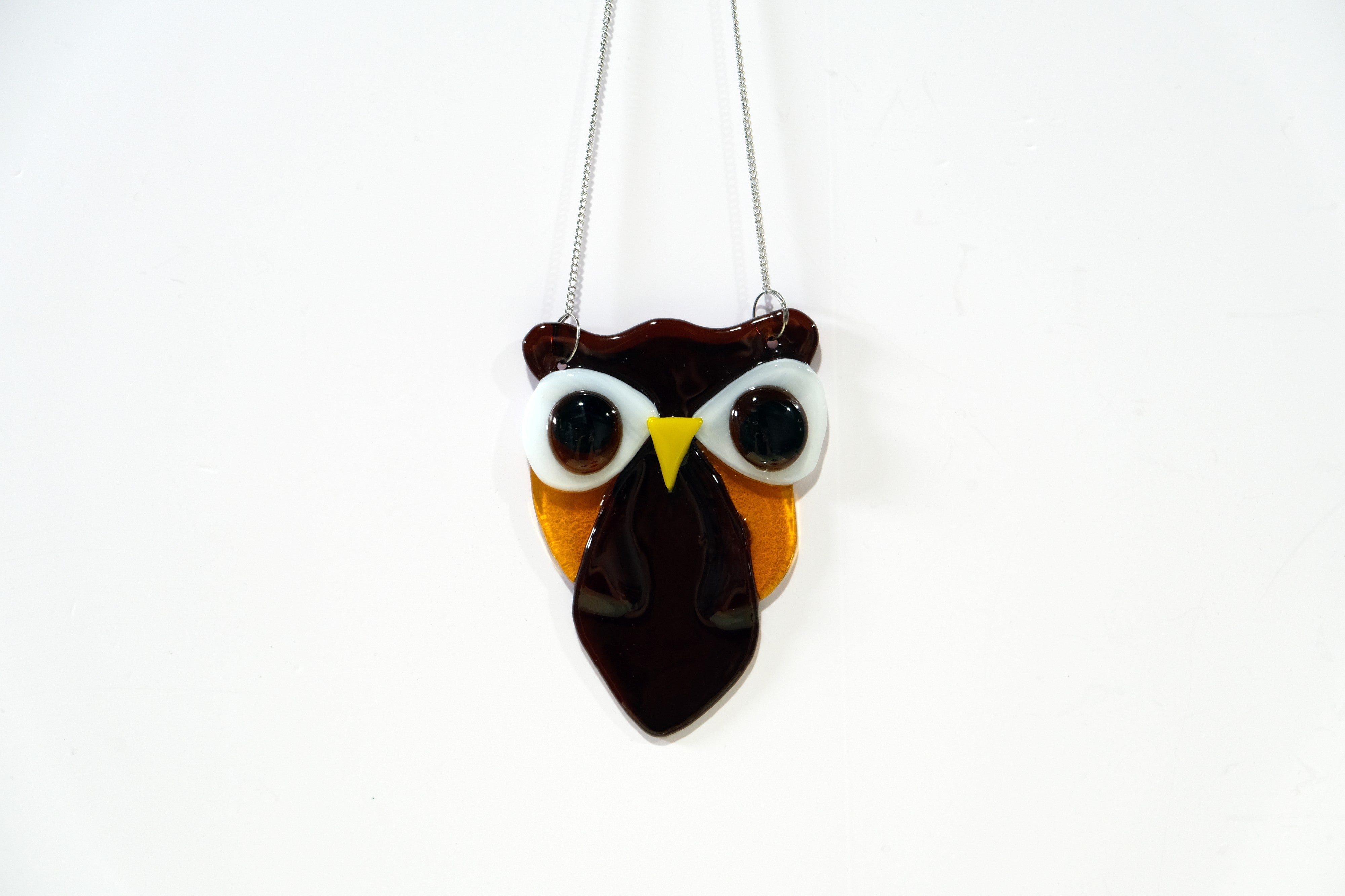 Brown and Amber Owl suncatcher, fused glass, on a steel hanging chain seedsglassworks, seeds glassworks