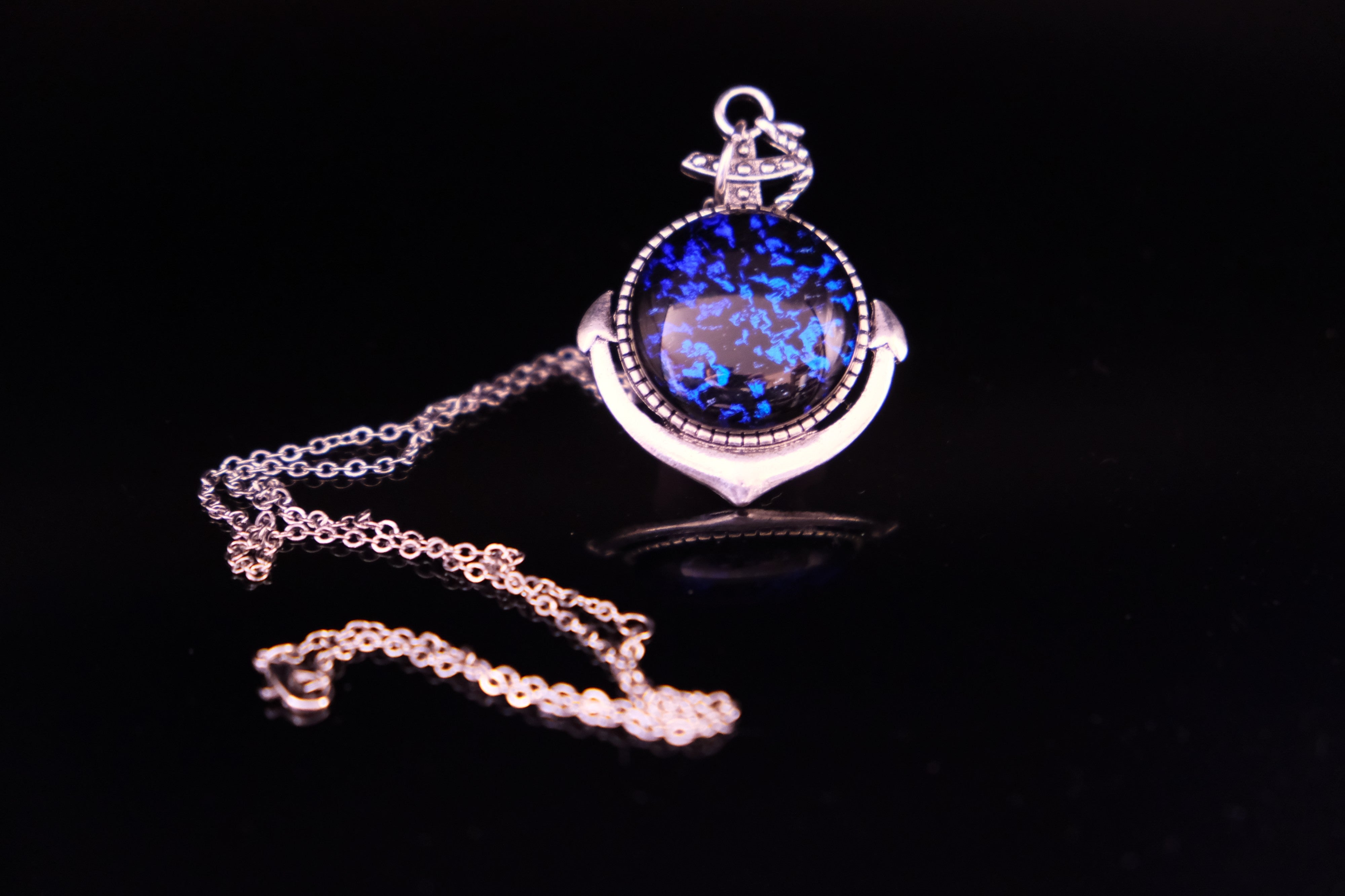 Silver Anchor pendant necklace, with blue and black sparkling dichroic fused glass center stone on a 20 inch steel chain