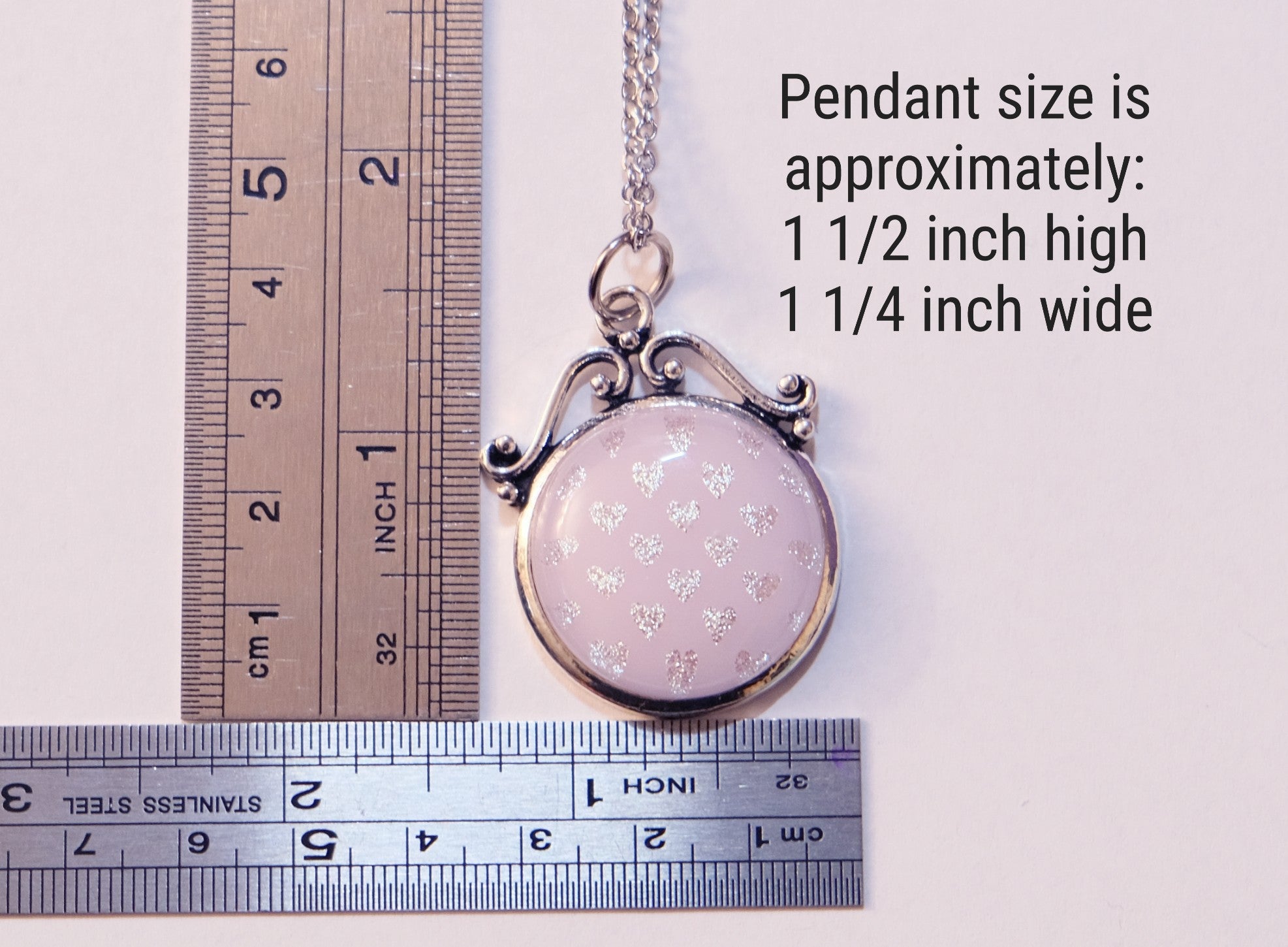 Pendant size measurement with a ruler on a white background