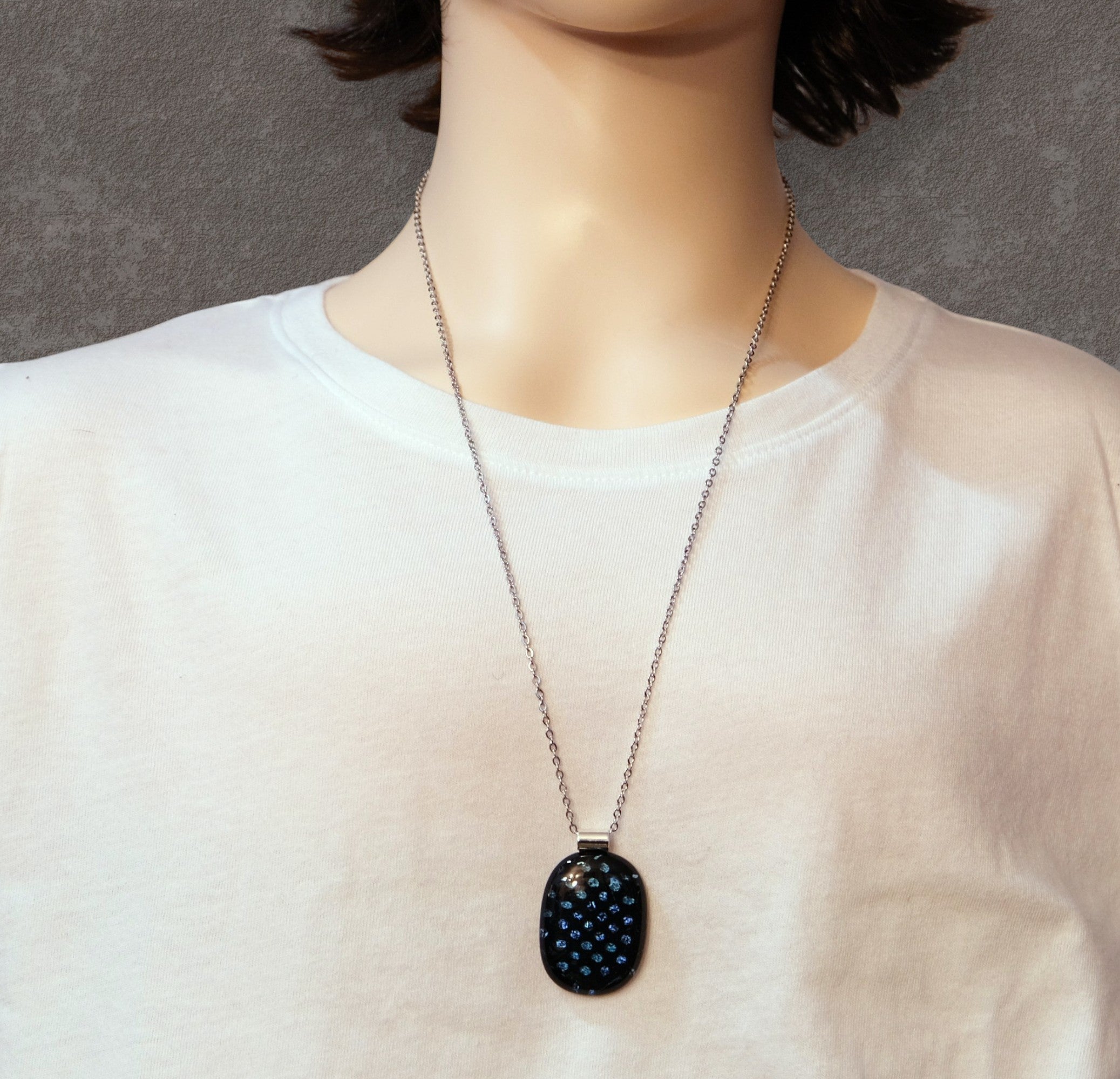Handcrafted Dichroic Glass Pendant Necklace, Blue Dots on Black, 24 Inch Steel Chain, Statement Jewelry, 1.75  x 1 pendant, seedsglassworks seeds glassworks. a person wearing a black and blue dot necklace