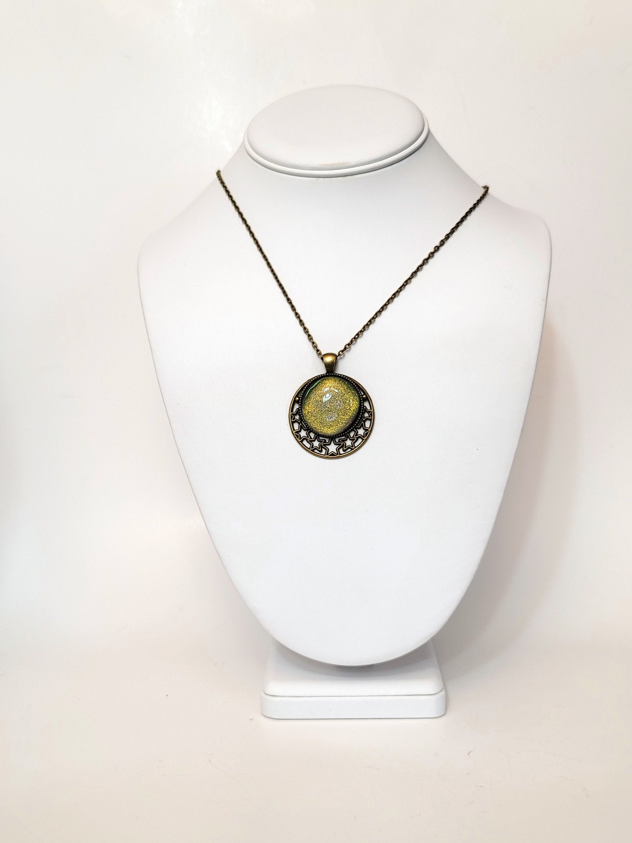 Brass Moon and Stars Pendant Necklace with Green dichroic glass cabochon on a 20 inch brass  chain.