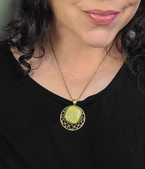 Brass Moon and Stars Pendant Necklace with Green dichroic glass cabochon on a 20 inch brass  chain.