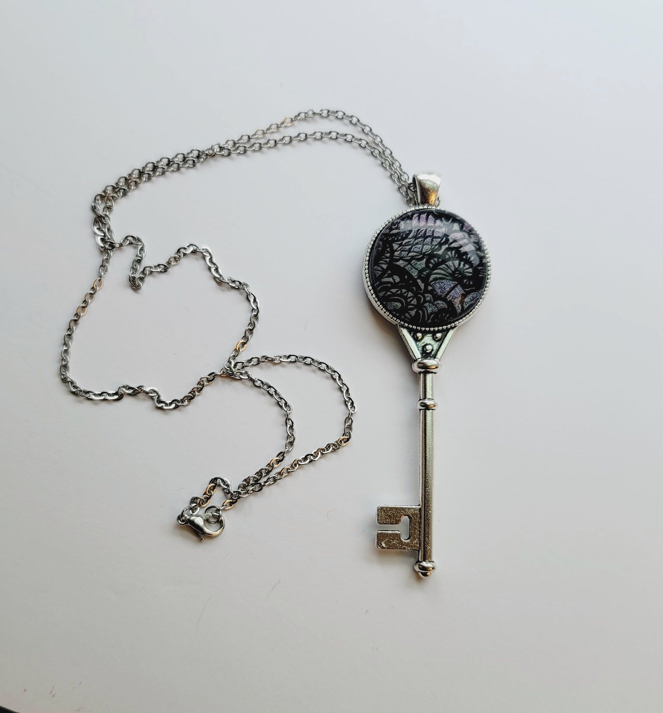 Silver tone Skeleton Key pendant necklace with Fused Glass dark Silver Lace cabochon on 24 inch steel chain jewelry seeds glassworks seedsglassworks