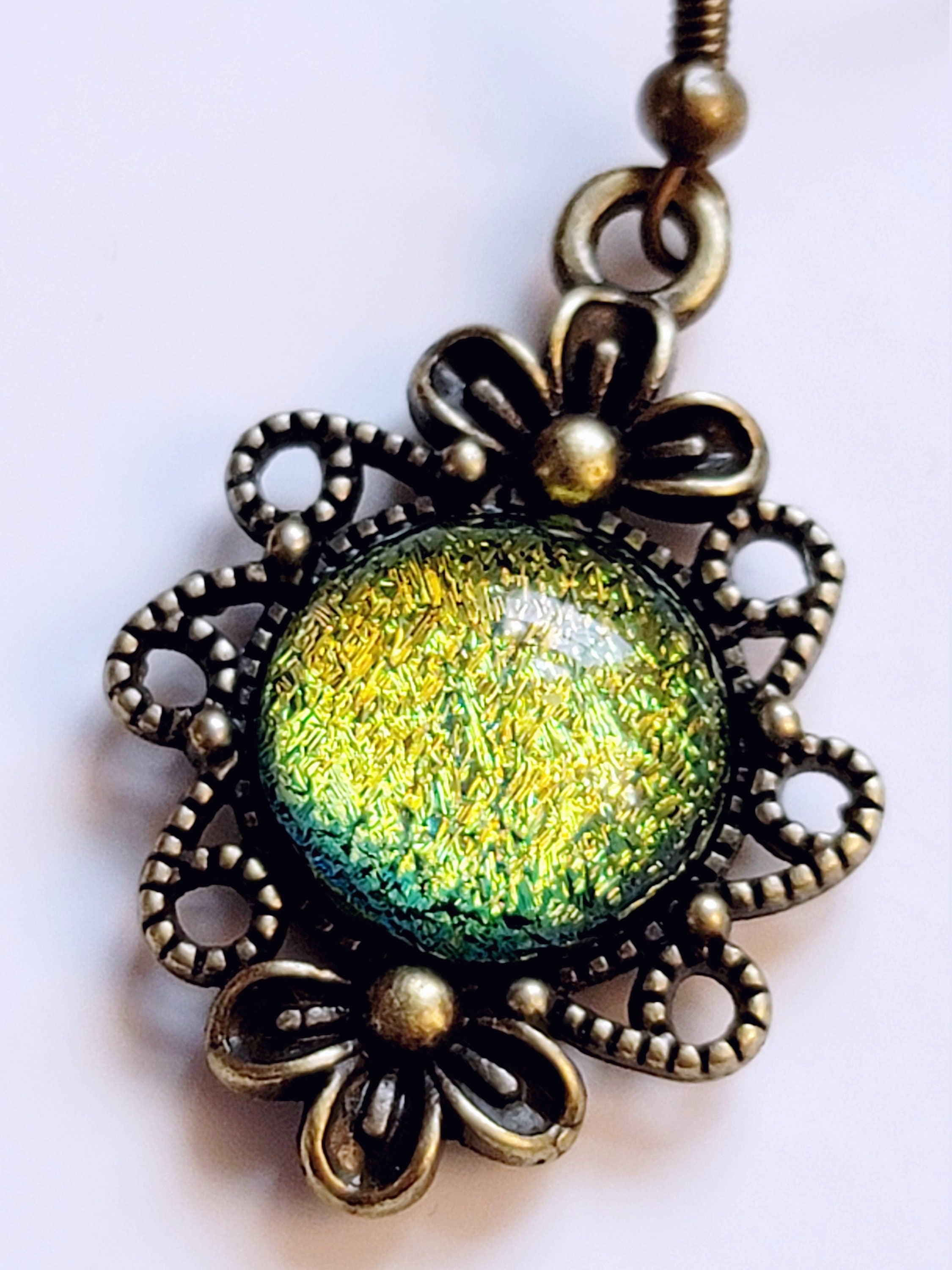 Brass flower earrings with color shifting green/yellow dichroic fused glass cabo pierced earrings seeds glassworks seedsglassworks