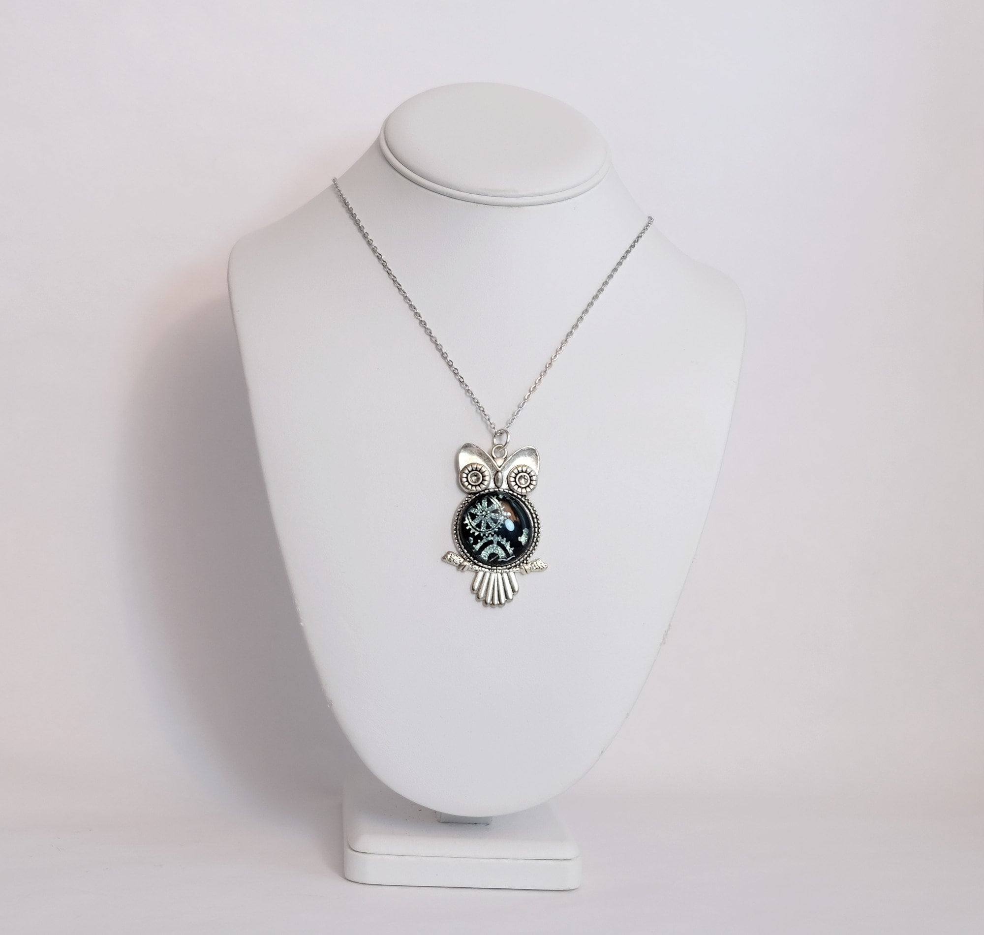 Gears Owl pendant necklace, silver tone  with silver gears on black dichroic fused glass center stone on an 20 inch steel chain