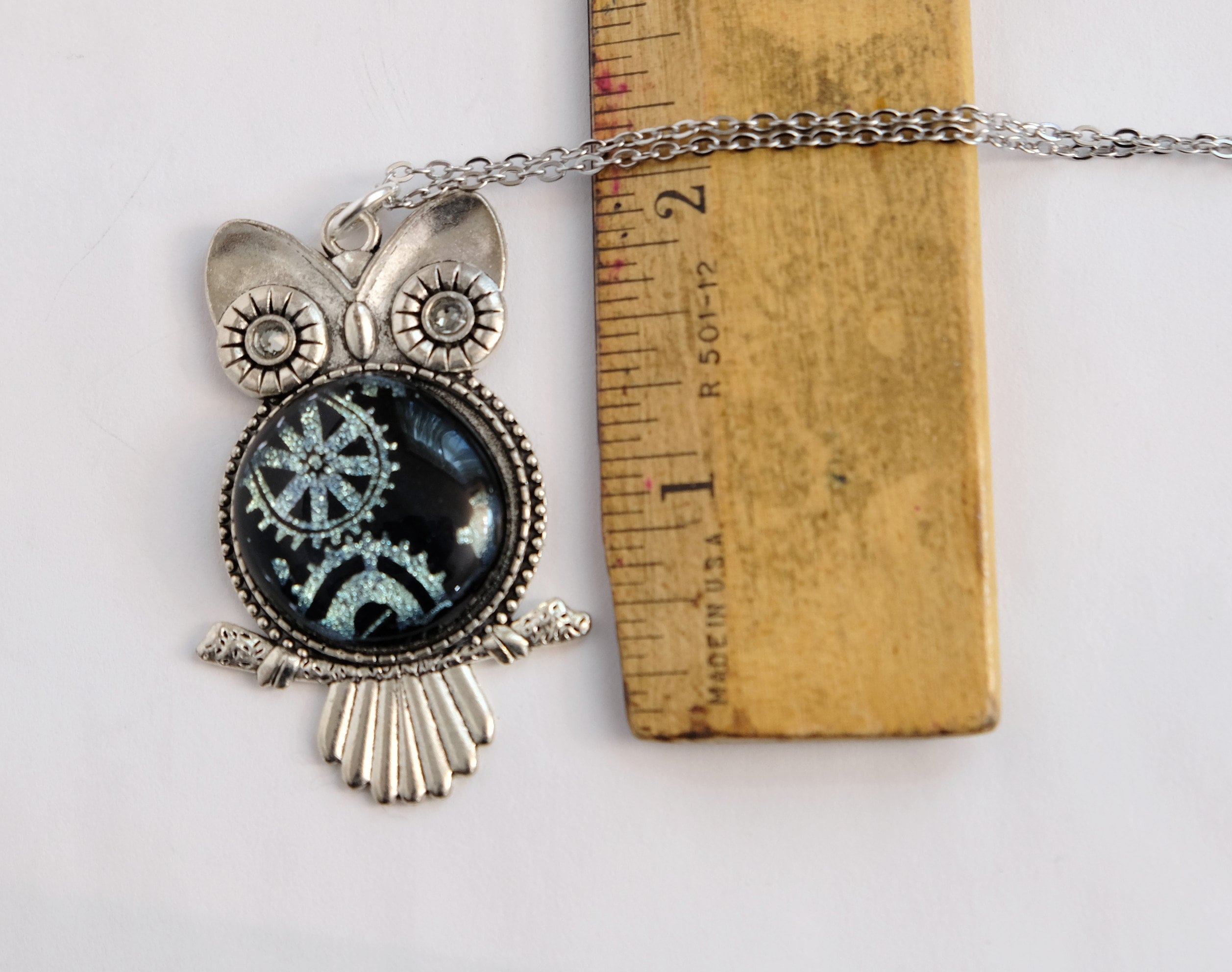 Gears Owl pendant necklace, silver tone  with silver gears on black dichroic fused glass center stone on an 20 inch steel chain