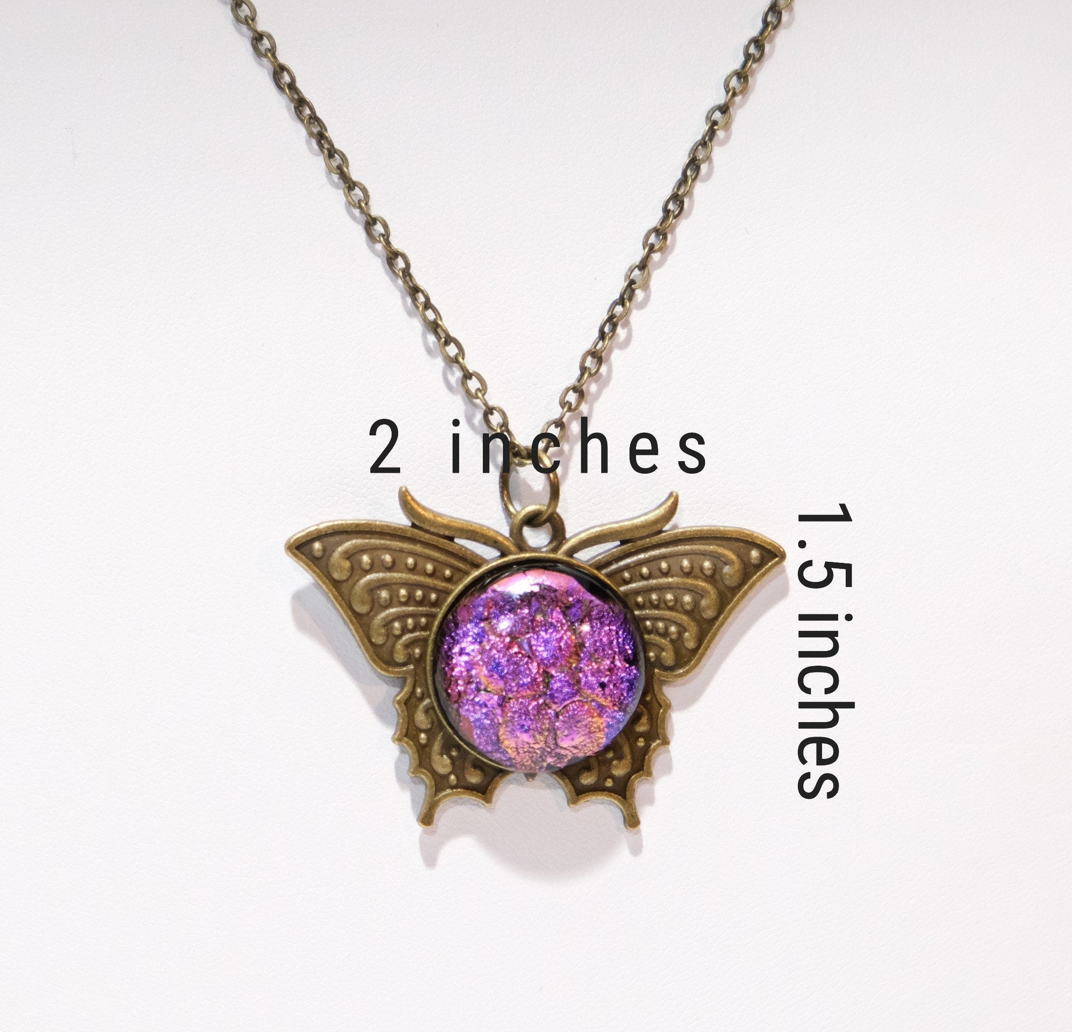 Butterfly pendant necklace, brass tone with pink purple dichroic fused glass center stone on a 20 inch brass tone chain seeds glassworks seedsglassworks