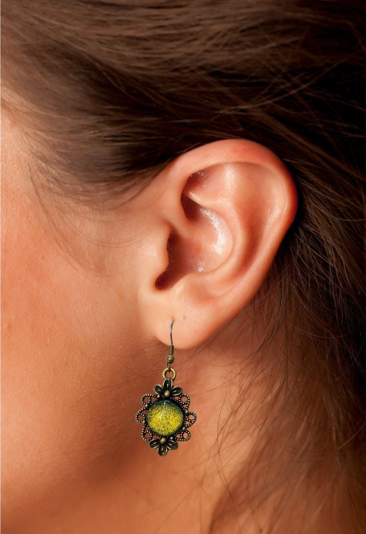 Brass flower earrings with color shifting green/yellow dichroic fused glass cabo pierced earrings seeds glassworks seedsglassworks