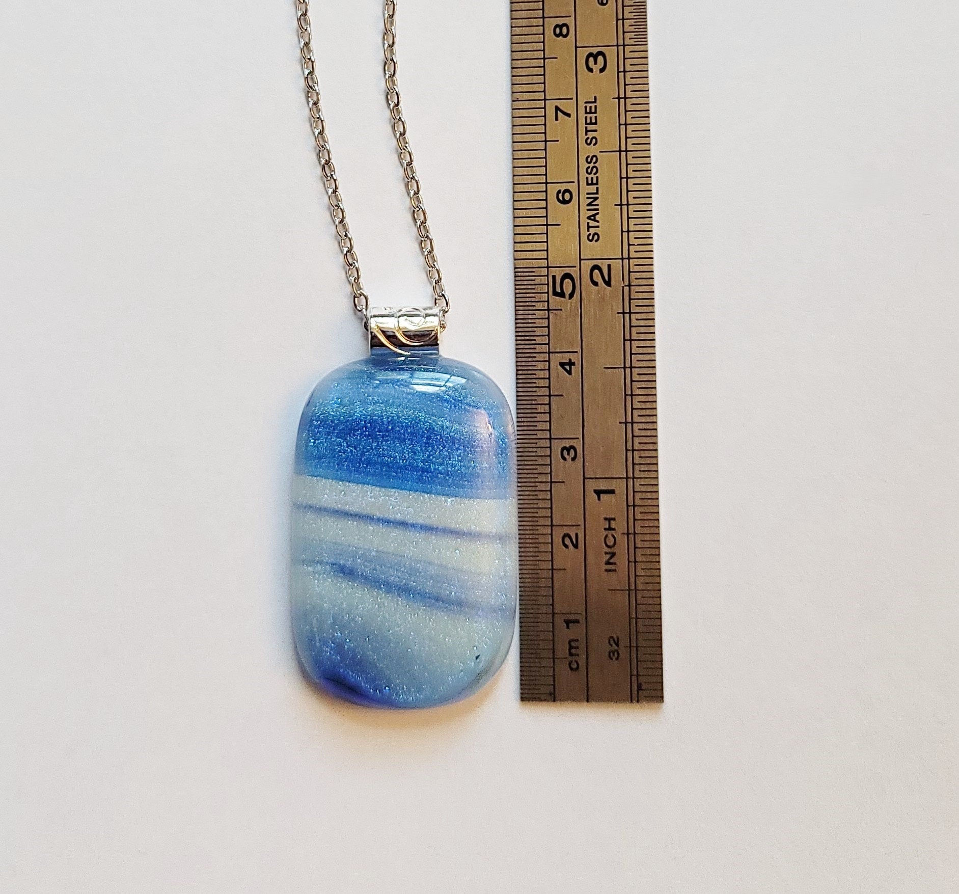 Dichroic Blue and White sparkly swirl fused glass pendant statement necklace on 24 inch steel chain. 1.75 x 1 inch pendant. sliver tone bail seeds glassworks seedsglassworks
