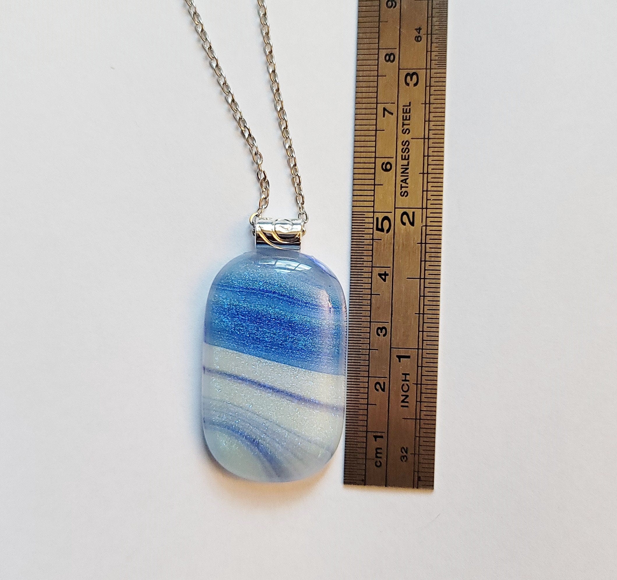 Blue and White sparkly swirl fused glass pendant statement necklace on 24 inch steel chain. 1.75 x 1 inch pendant. sliver tone bail seeds glassworks seedsglassworks