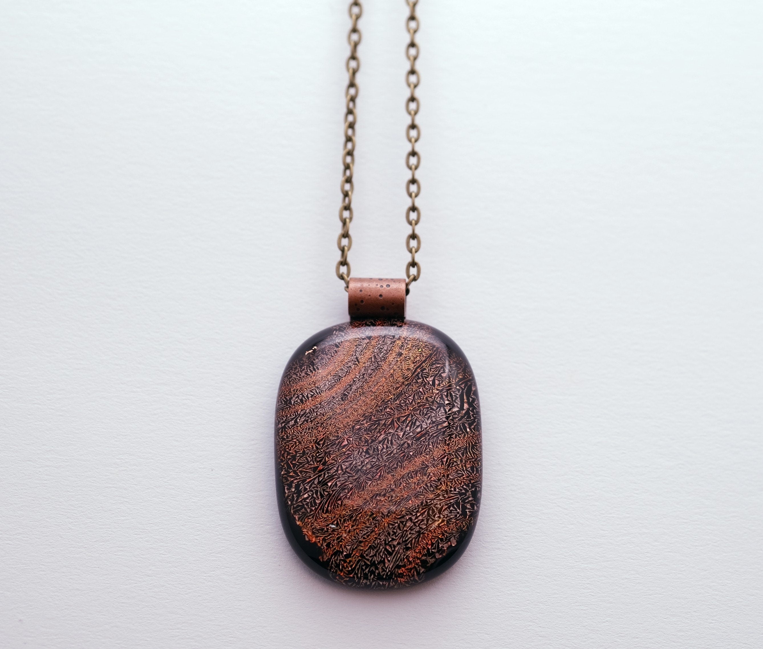 Dichroic Orange and Black Sparkling Swirls fused Glass Statement Pendant necklace on 24 inch antiqued brass Chain, seeds glassworks seedsglassworks