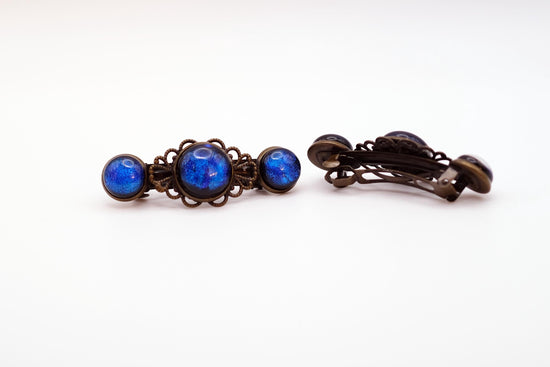 Barrette pair, bronze flowers with blue dichroic fused glass cabochons, french clip, 2 1/4 inches seeds glassworks seedsglassworks