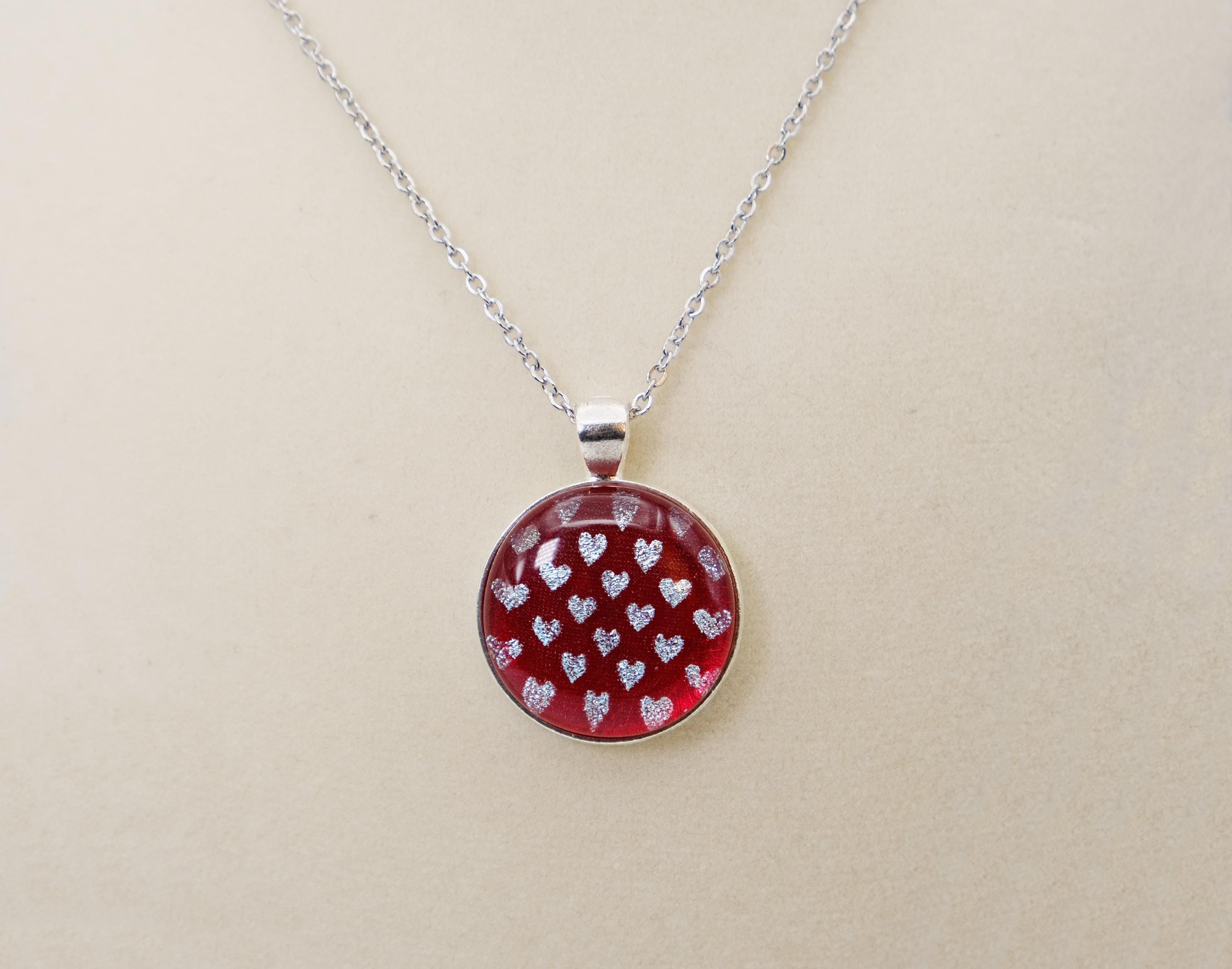 Silver tone  pendant necklace with Fused Glass Red with dichroic hearts pattern cabochon on 24 inch steel chain jewelry seeds glassworks seedsglassworks