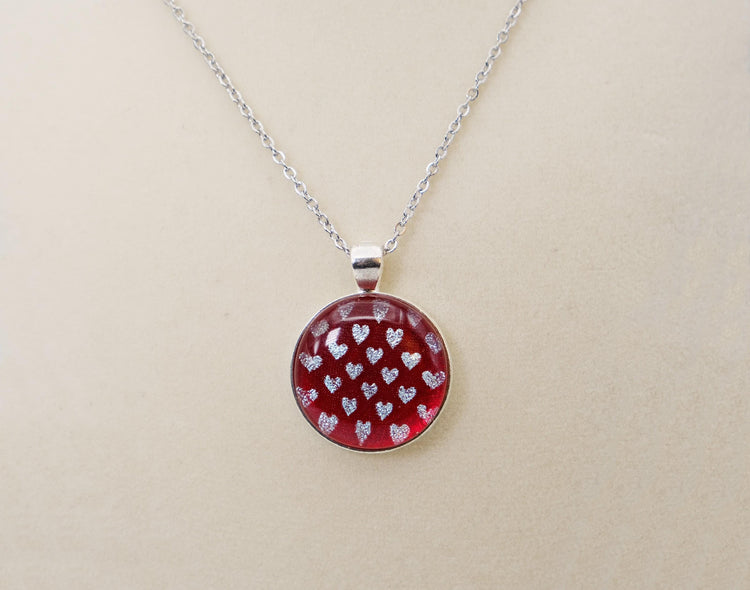 Silver tone  pendant necklace with Fused Glass Red with dichroic hearts pattern cabochon on 24 inch steel chain jewelry seeds glassworks seedsglassworks