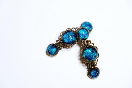 Barrette pair, bronze flowers with blue dichroic fused glass cabochons, french clip, 2 1/4 inches seeds glassworks seedsglassworks