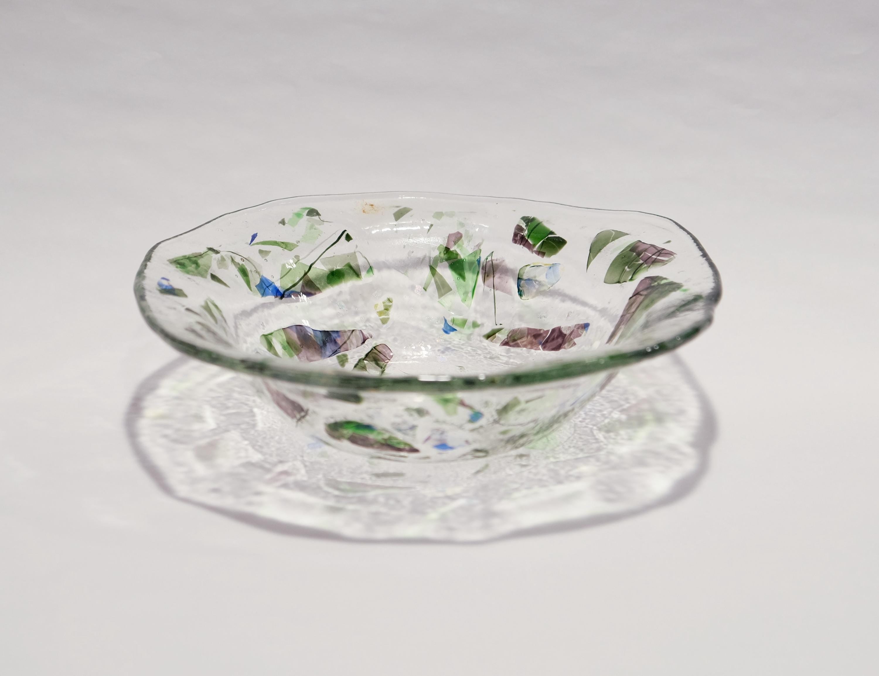 Unique 8.5 Inch one of a kind fused glass bowl with dichroic, green and purple accents on a clear base. organic shape. home decor gift