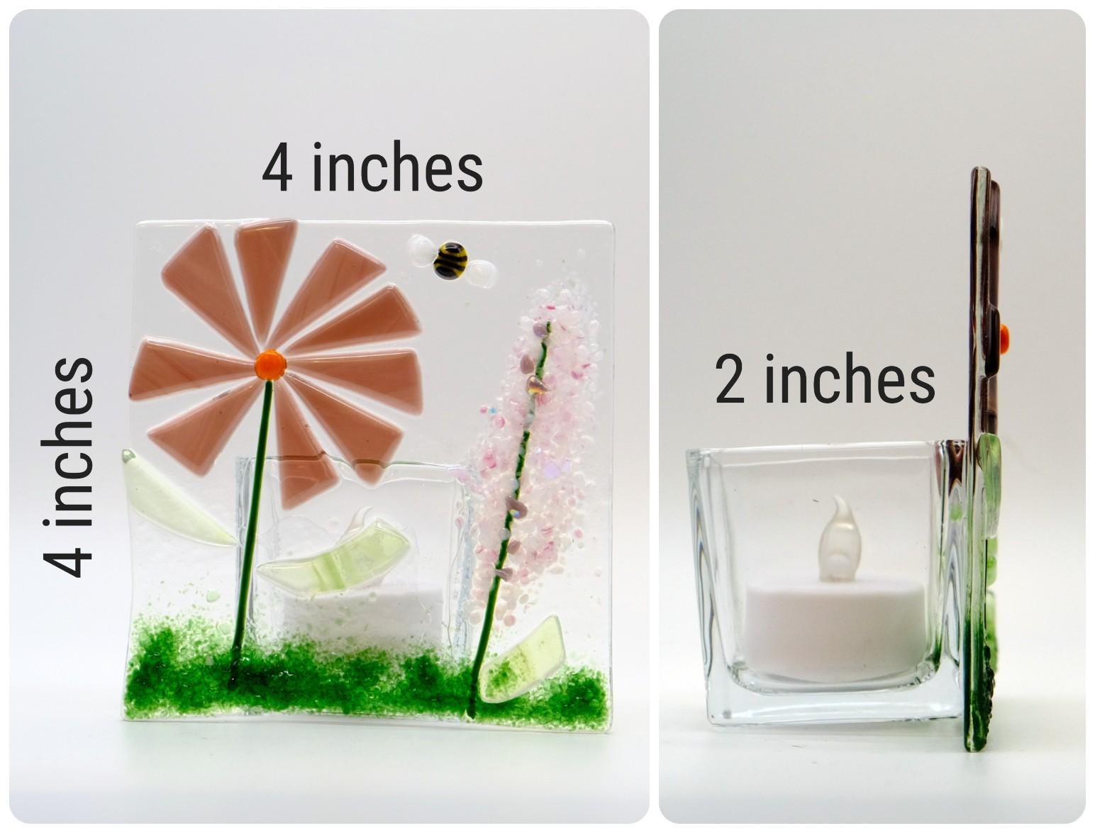 Two glass candle holders with measurements on a white background