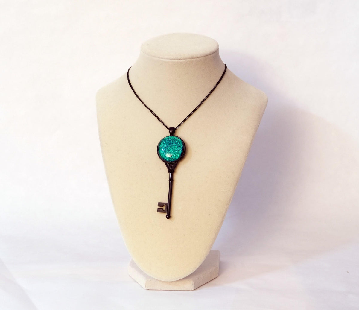 Black Metal Skeleton Key pendant necklace with Green Blue Dichroic Fused Glass cabochon on 24-inch black chain jewelry. steampunk Victorian