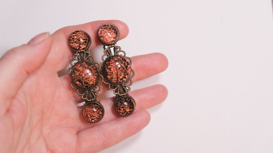 Barrette pair, bronze flowers with orange dichroic fused glass cabochons, french clip, 2 1/4 inches seeds glassworks seedsglassworks
