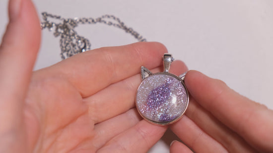 Silver Cat pendant necklace, with pink/purple/white sparkling dichroic fused glass center stone on a 20 inch steel chain seeds glassworks seedsglassworks