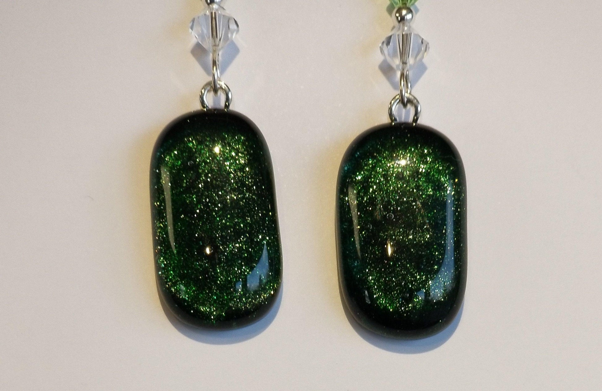Green sparkle fused glass pierced dangle earrings, silver wire , crystal bead accents