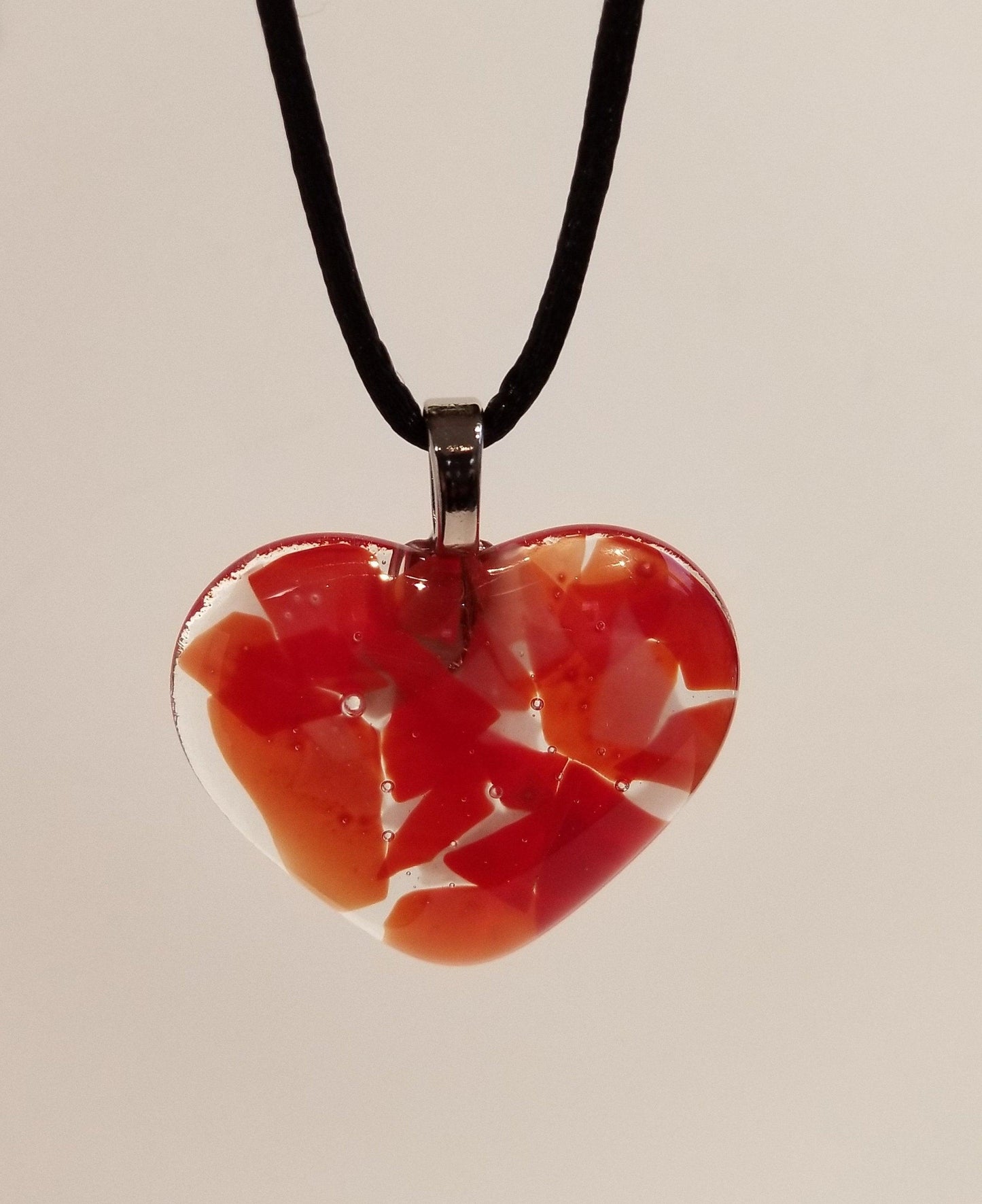 Shades of red fused Glass Heart Pendant necklace on 18 inch stainless steel chain