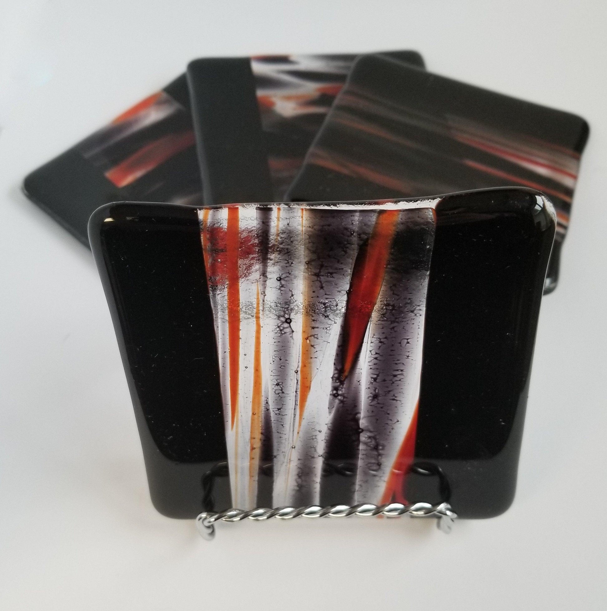 Black and red swirl fused glass coasters, set of 4. From Seeds Glassworks, seedsglassworks