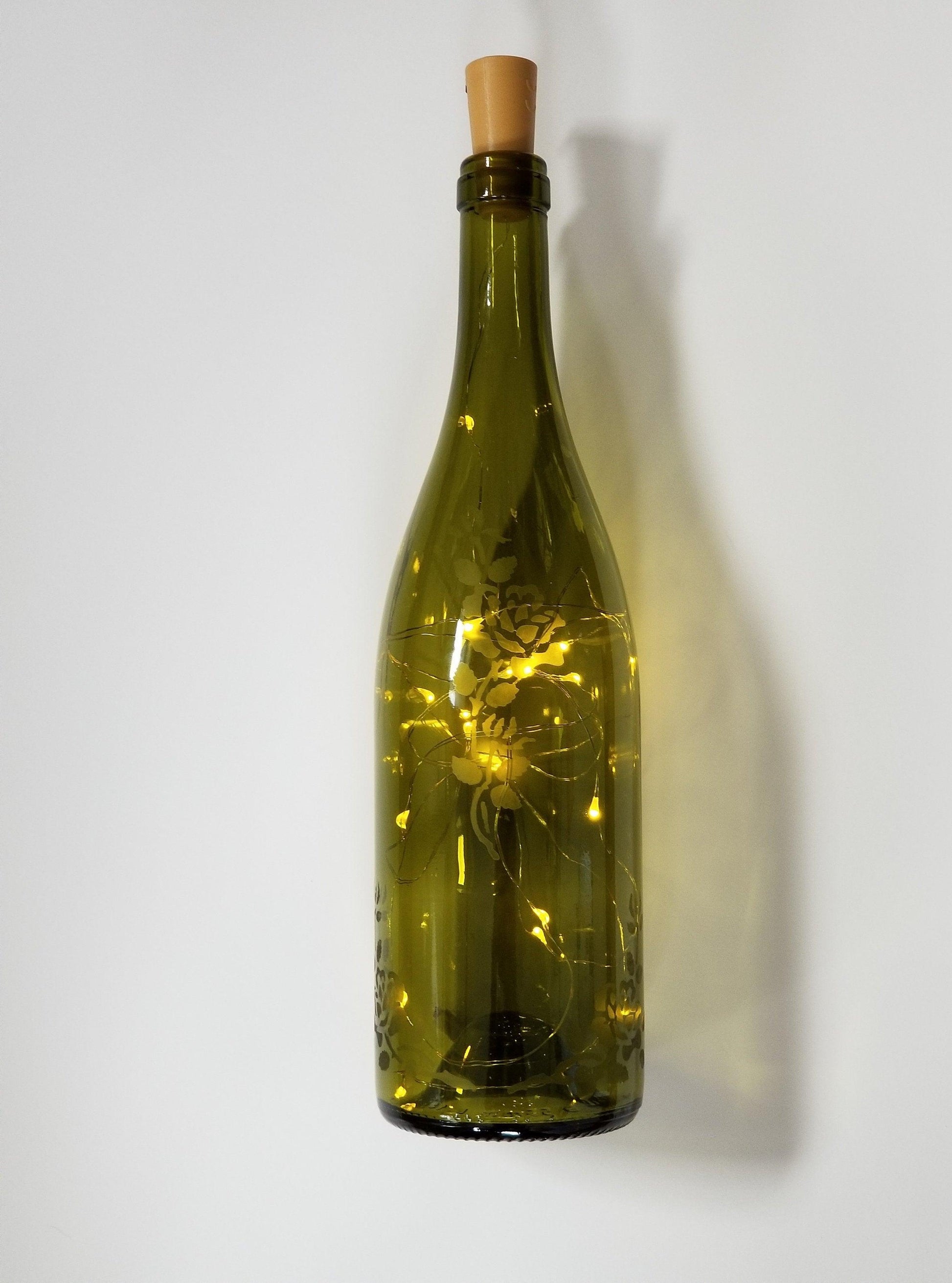 Recycled Wine Bottle with Fairy Lights and Rose Etching from seeds glassworks