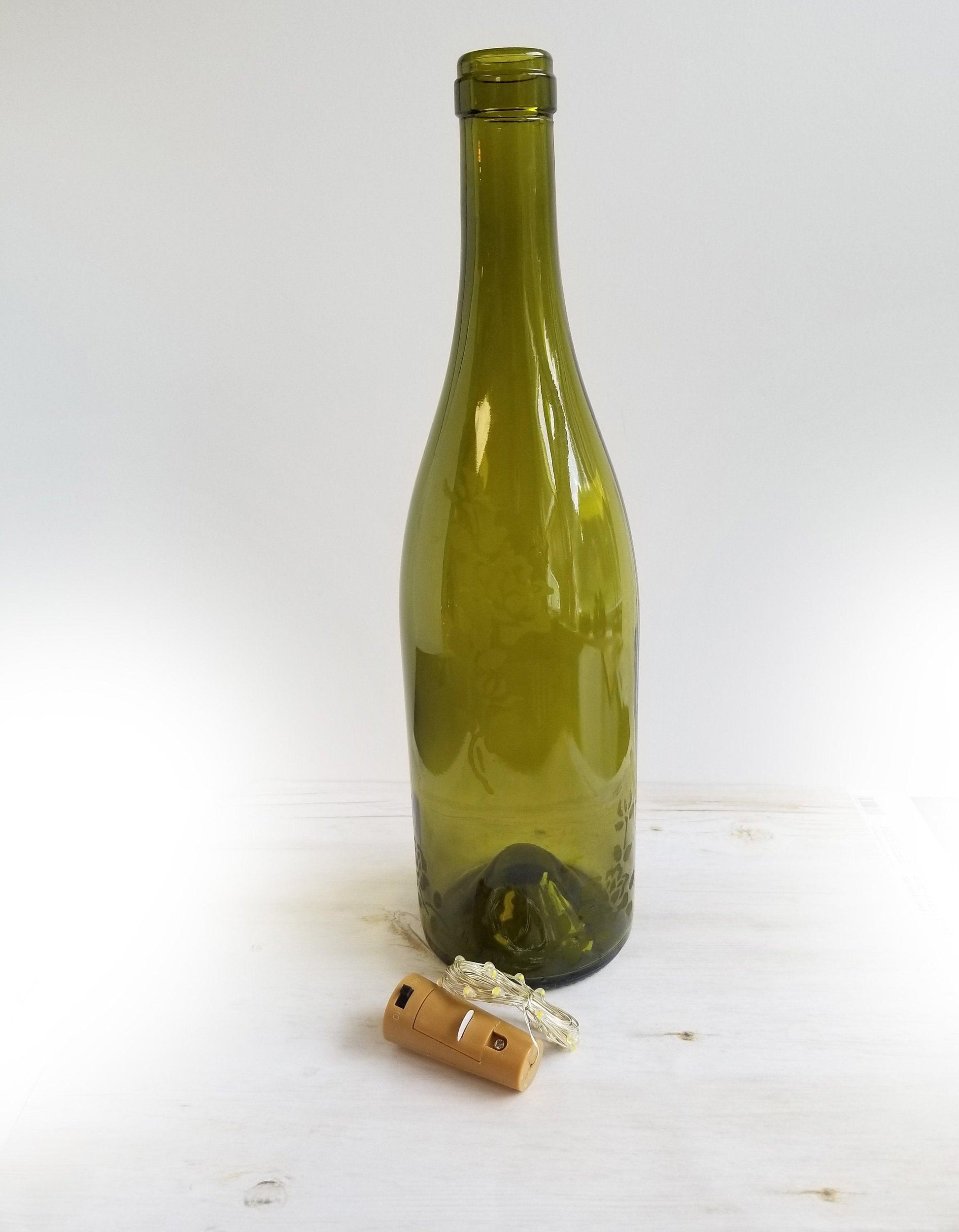 Recycled Wine Bottle with Fairy Lights and Rose Etching from seeds glassworks