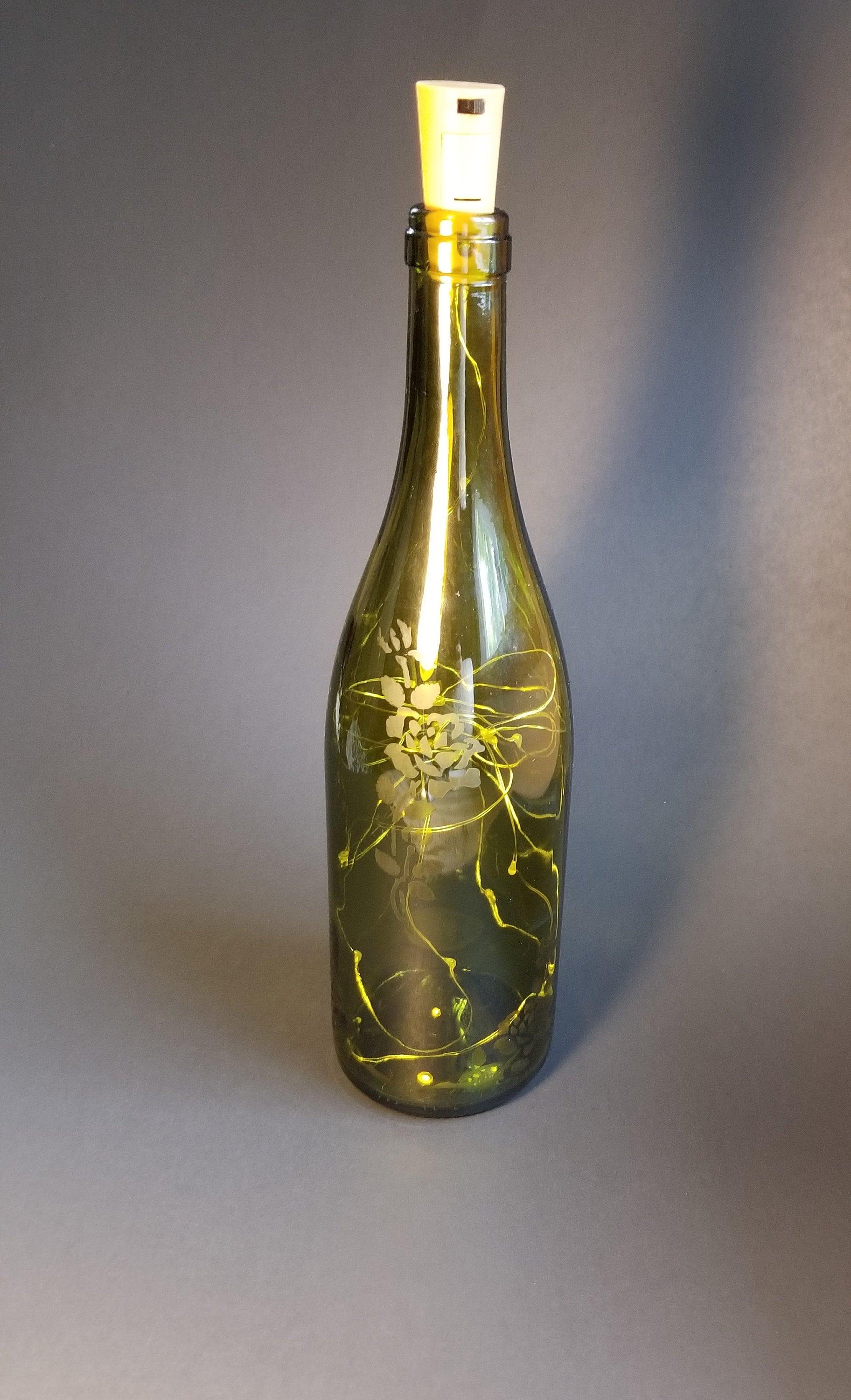 Recycled Wine Bottle with Fairy Lights and Rose Etching from seeds glassworks