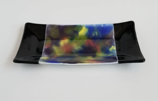 fused glass 10 inch serving plate with colorful rainbow swirls and black accents, from Seeds Glassworks