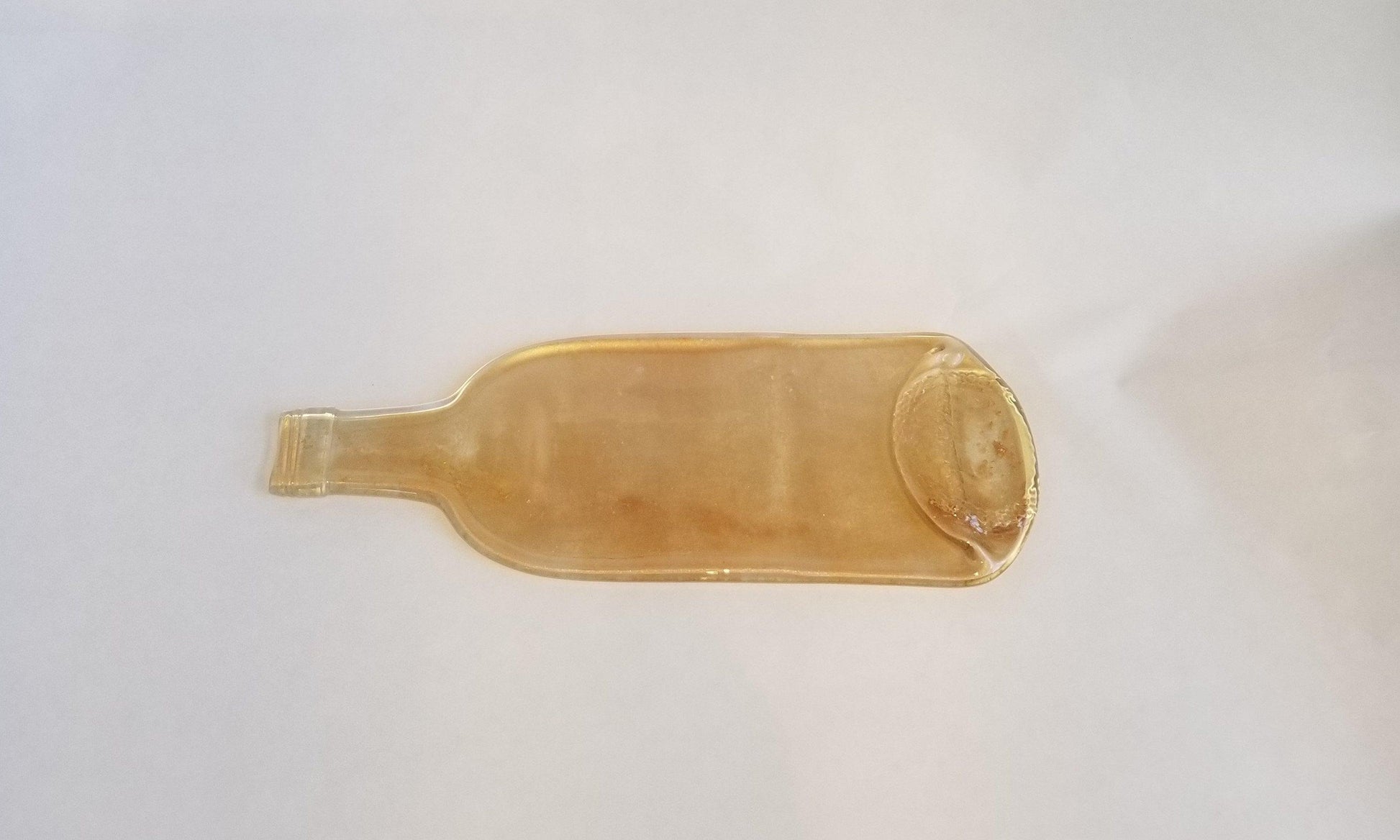 Melted Flat Wine Bottle with Mica Sparkes Cheeseplate, light gold splatter from seeds glassworks