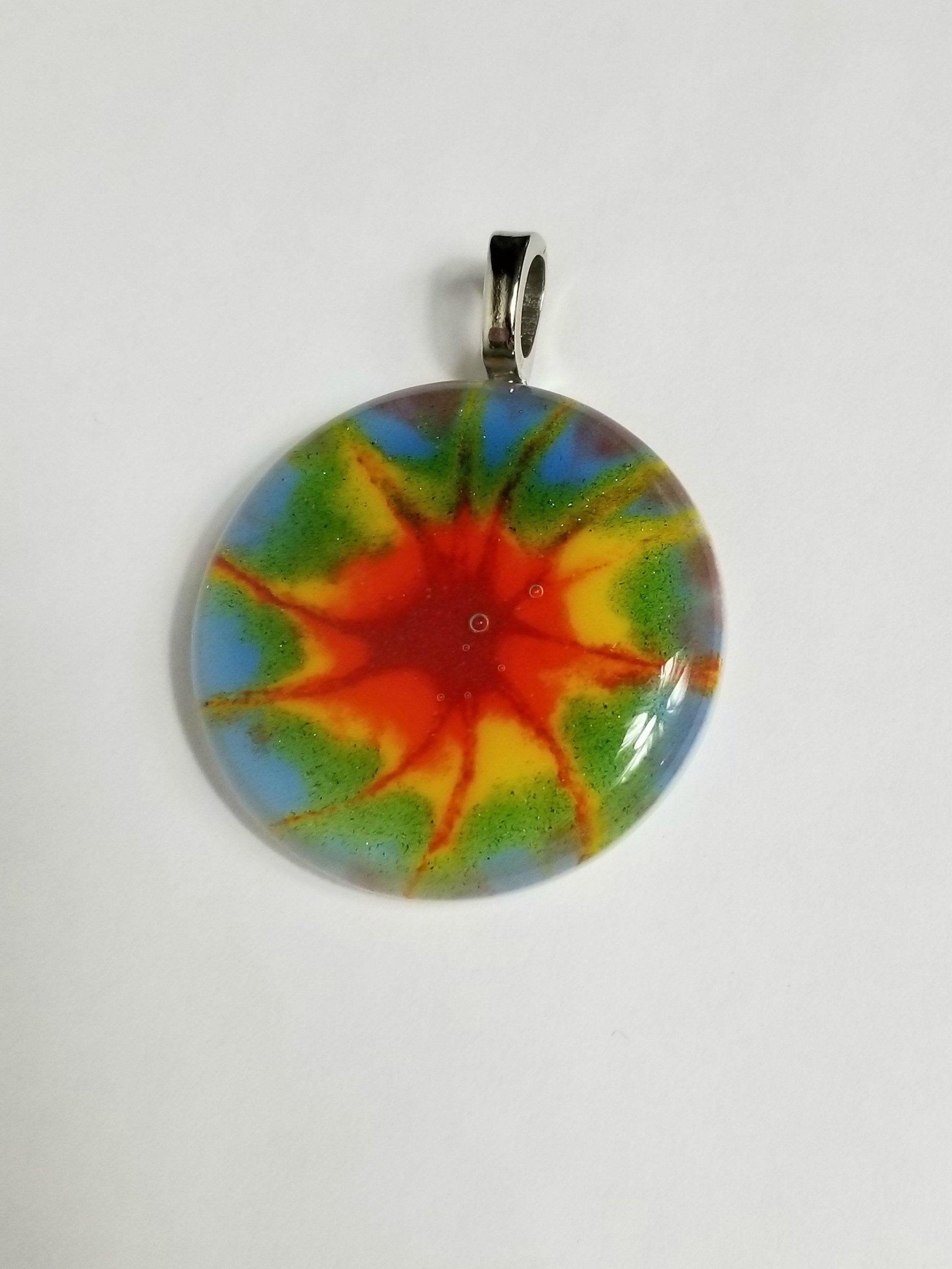 Tie Dye look fused glass Circle necklace, rainbow color from seeds glassworks seedsglassworks