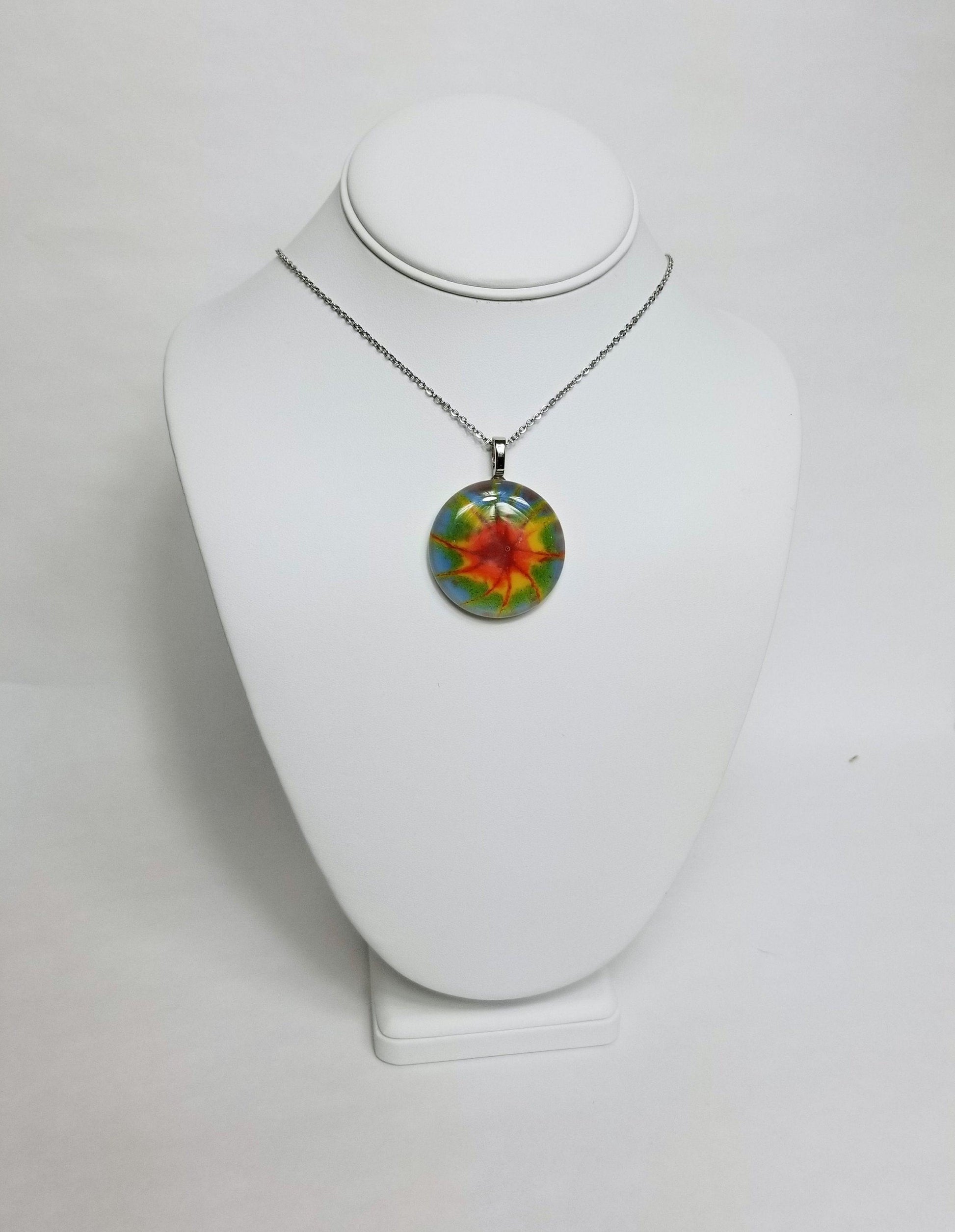 Tie Dye look fused glass Circle necklace, rainbow color from seeds glassworks seedsglassworks