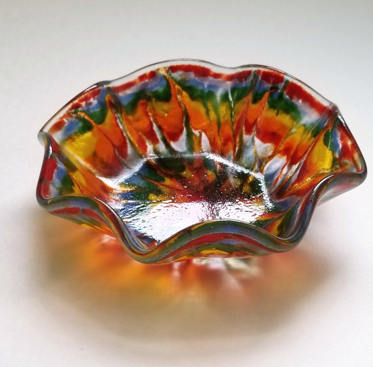 Tie Dyed ruffle edge 5 inch fused glass bowl. Seeds Glassworks