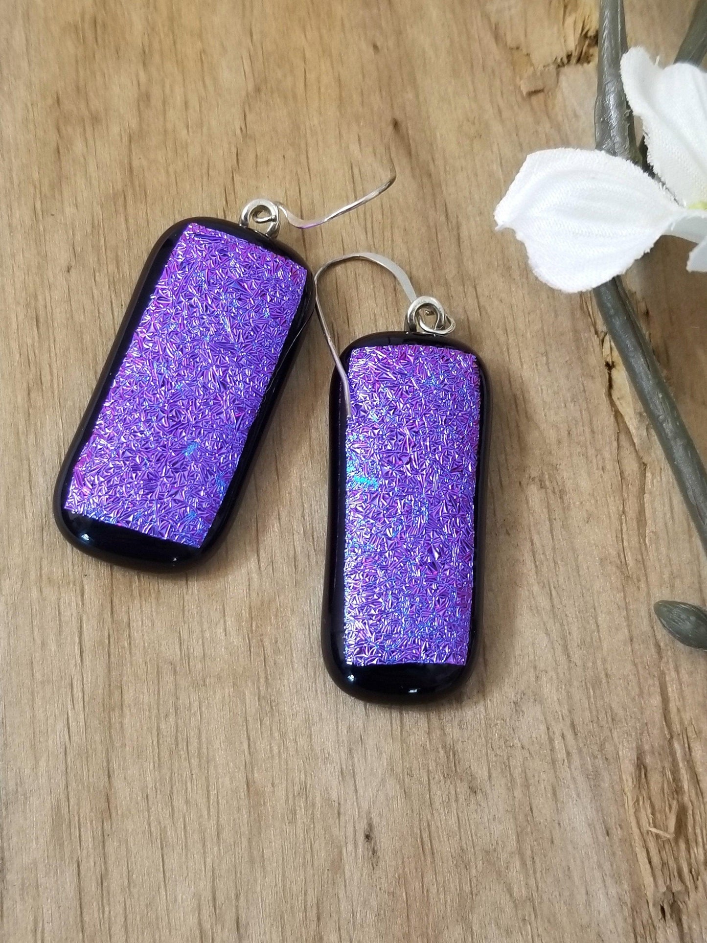 fused glass sparkling purple pierced dangle earrings. Seeds Glassworks 