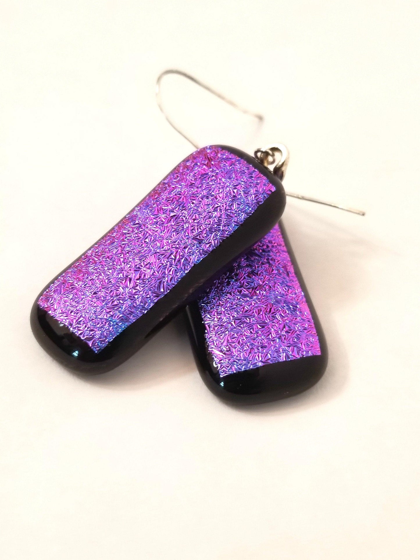 fused glass sparkling purple pierced dangle earrings. Seeds Glassworks