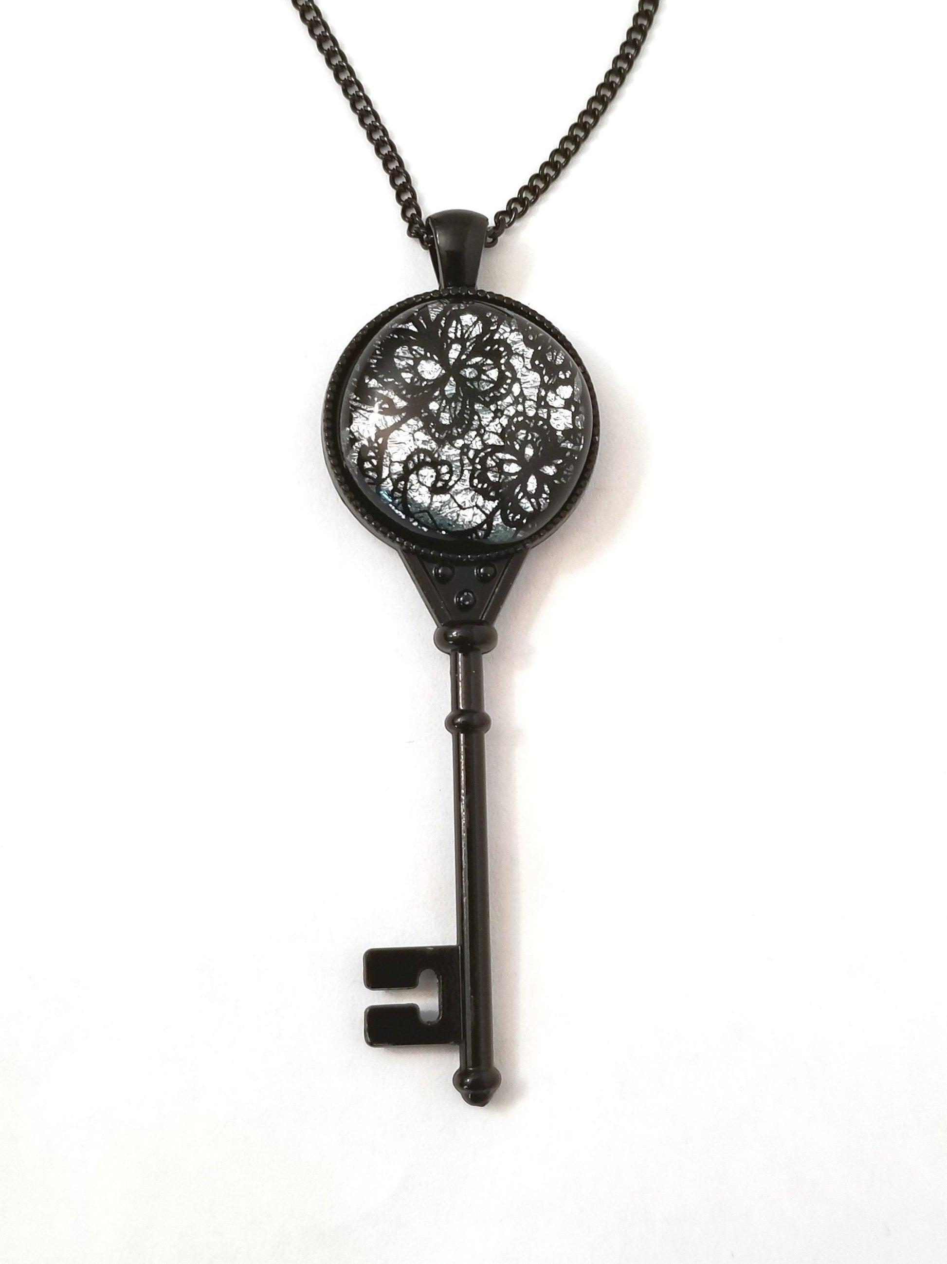 Black Metal Skeleton Key with Fused Glass Silver Lace cabochon on 24 inch black chain Seeds Glassworks  seedsglassworks