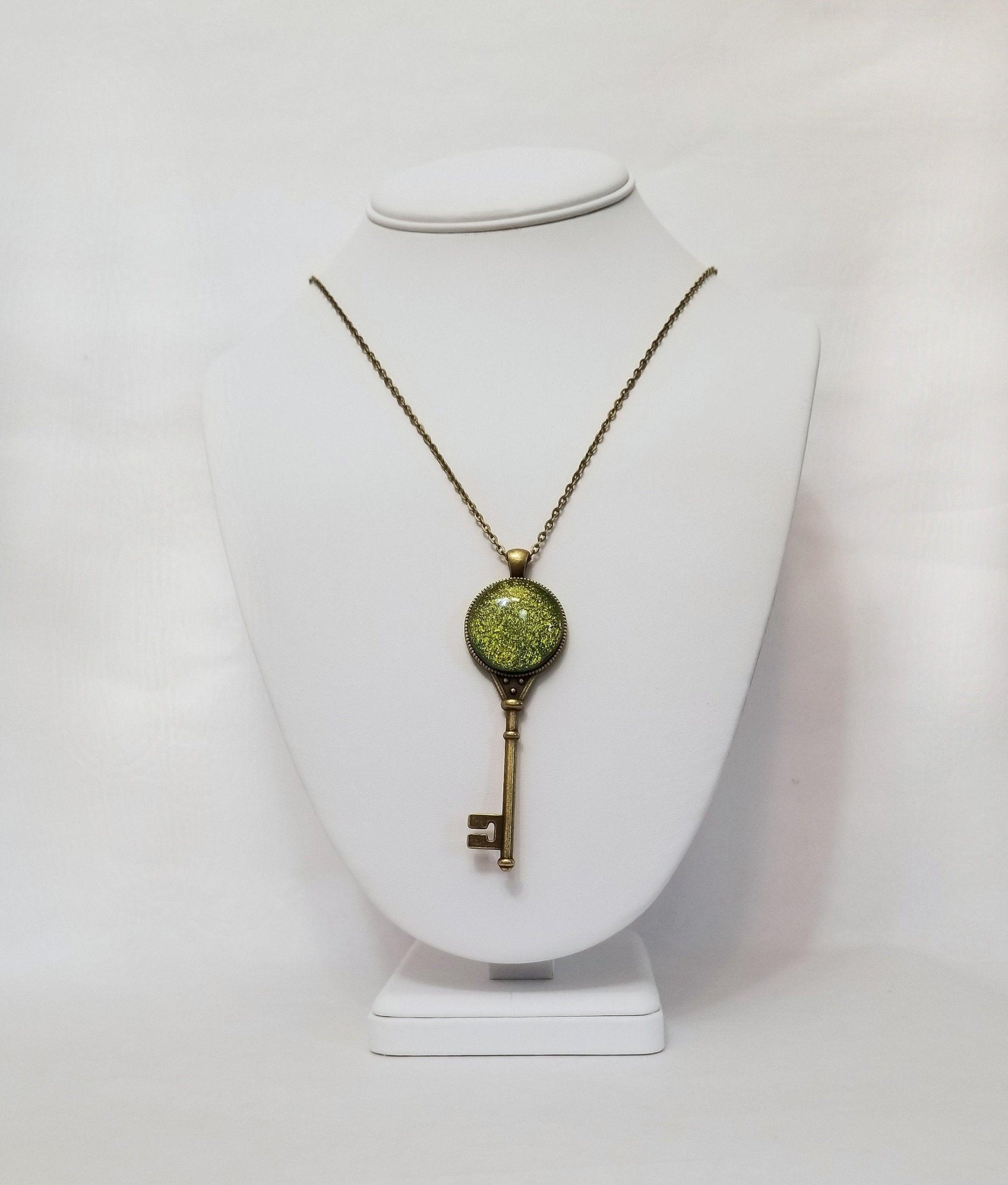 Antiqued Brass  Skeleton Key necklace with Fused Glass Green Dichroic cabochon on 24 inch brass plated chain