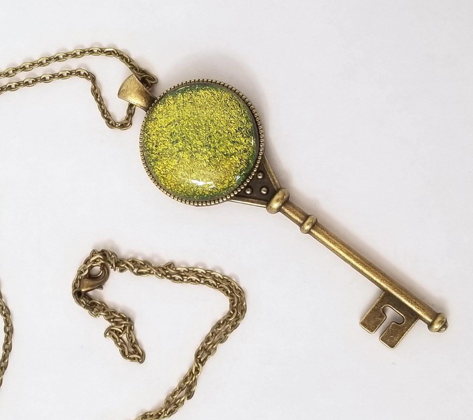 Antiqued Brass  Skeleton Key necklace with Fused Glass Green Dichroic cabochon on 24 inch brass plated chain