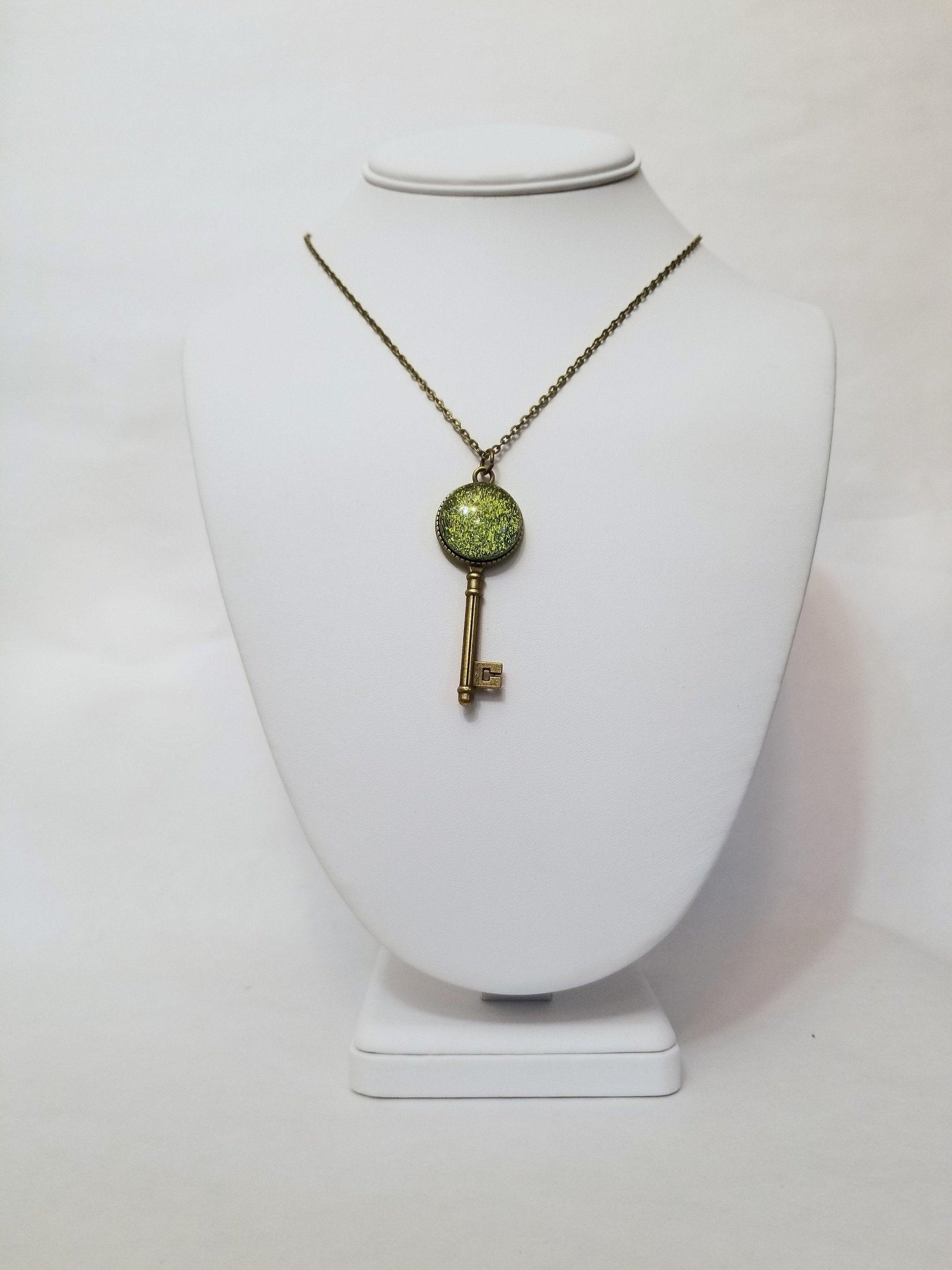 Antiqued Brass Small  Skeleton Key with Fused Glass Green Dichroic cabochon on 24 inch brass plated chain
