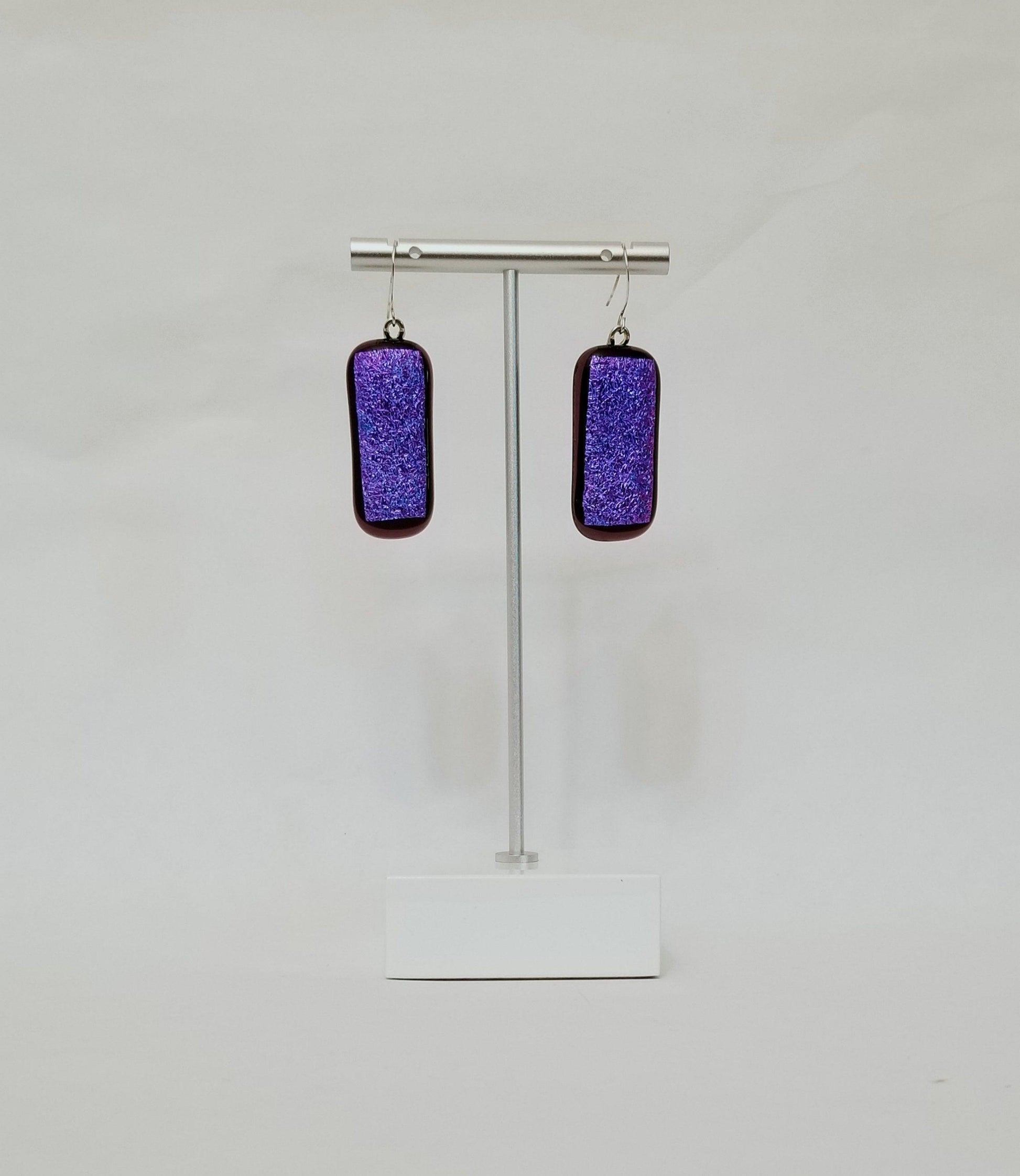 fused glass sparkling purple pierced dangle earrings. Seeds Glassworks