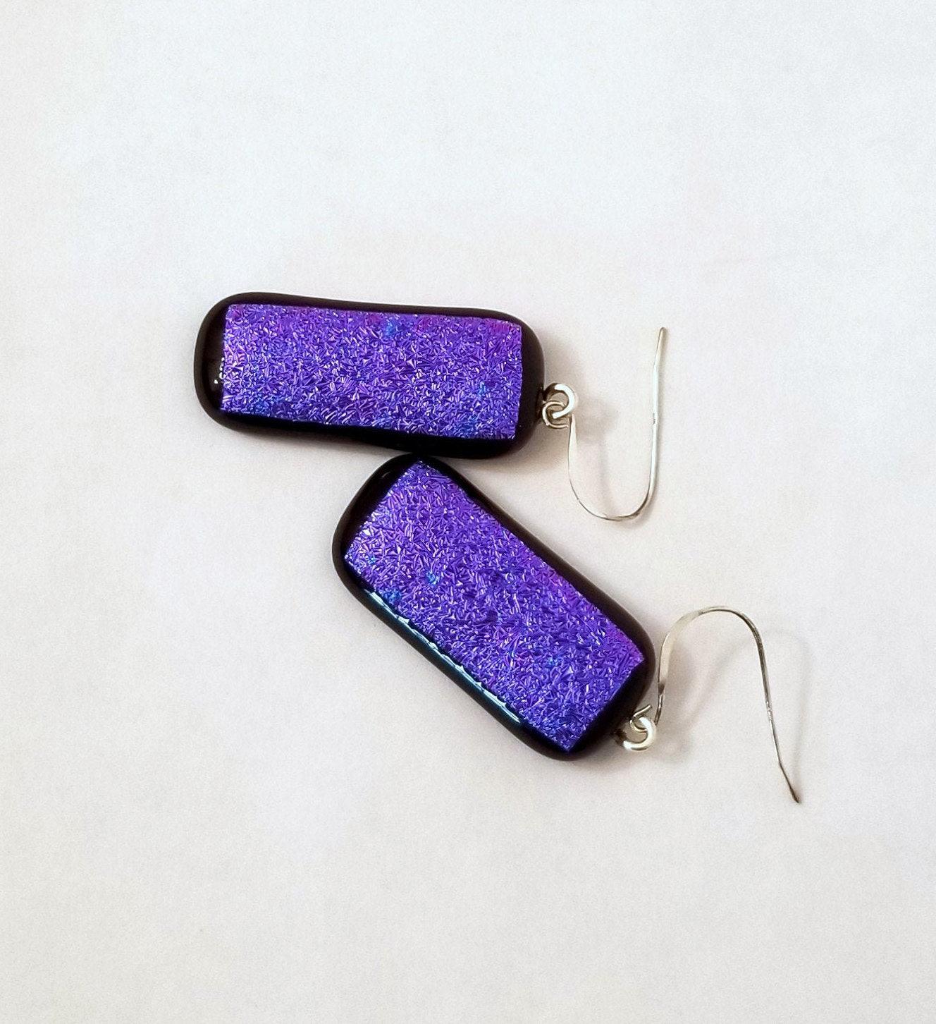 fused glass sparkling purple pierced dangle earrings. Seeds Glassworks